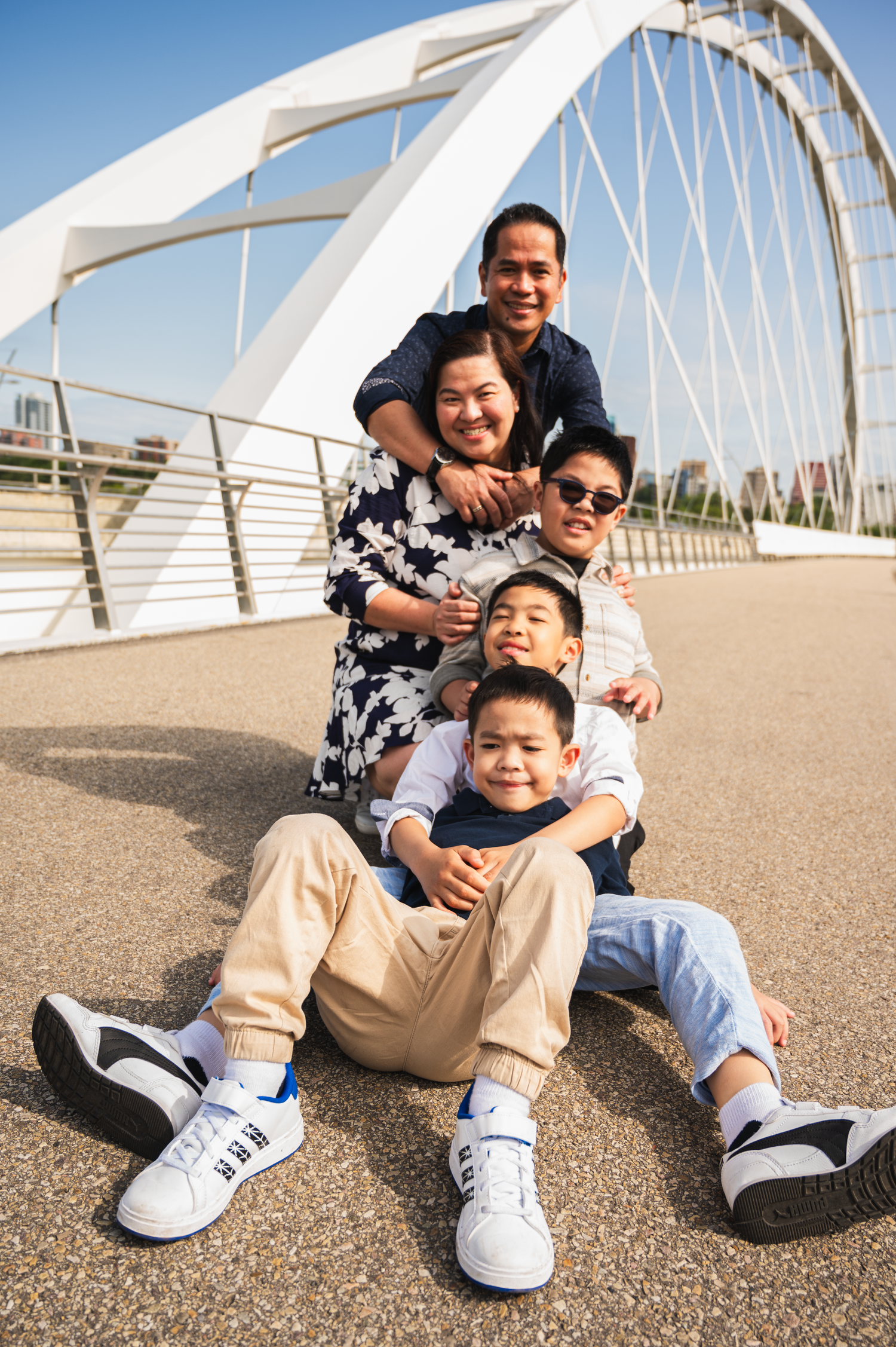 Family of five enjoying an outdoor photography session in Edmonton.

 a fun and relaxed photo of them together