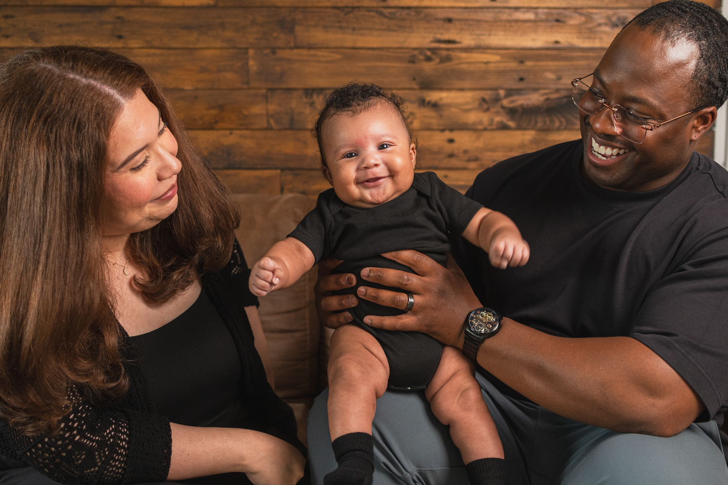 Professional studio newborn session in Edmonton.

baby smiling for the photo