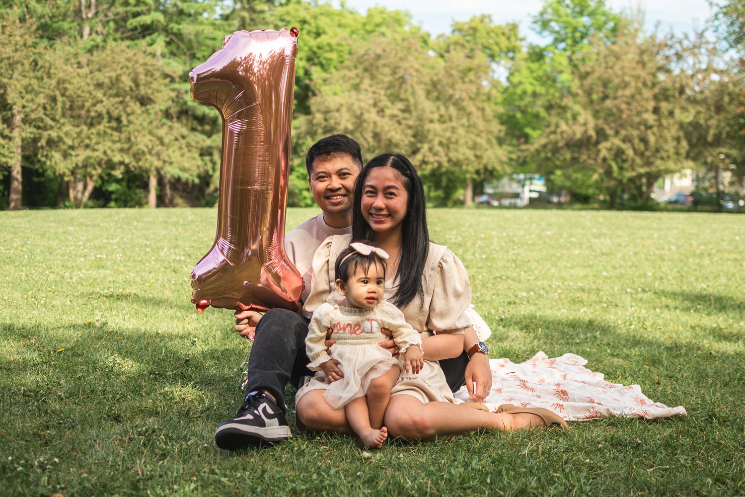Parents posing with their newborn baby during a lifestyle session in Edmonton.

For the upcoming 1-year-old birthday