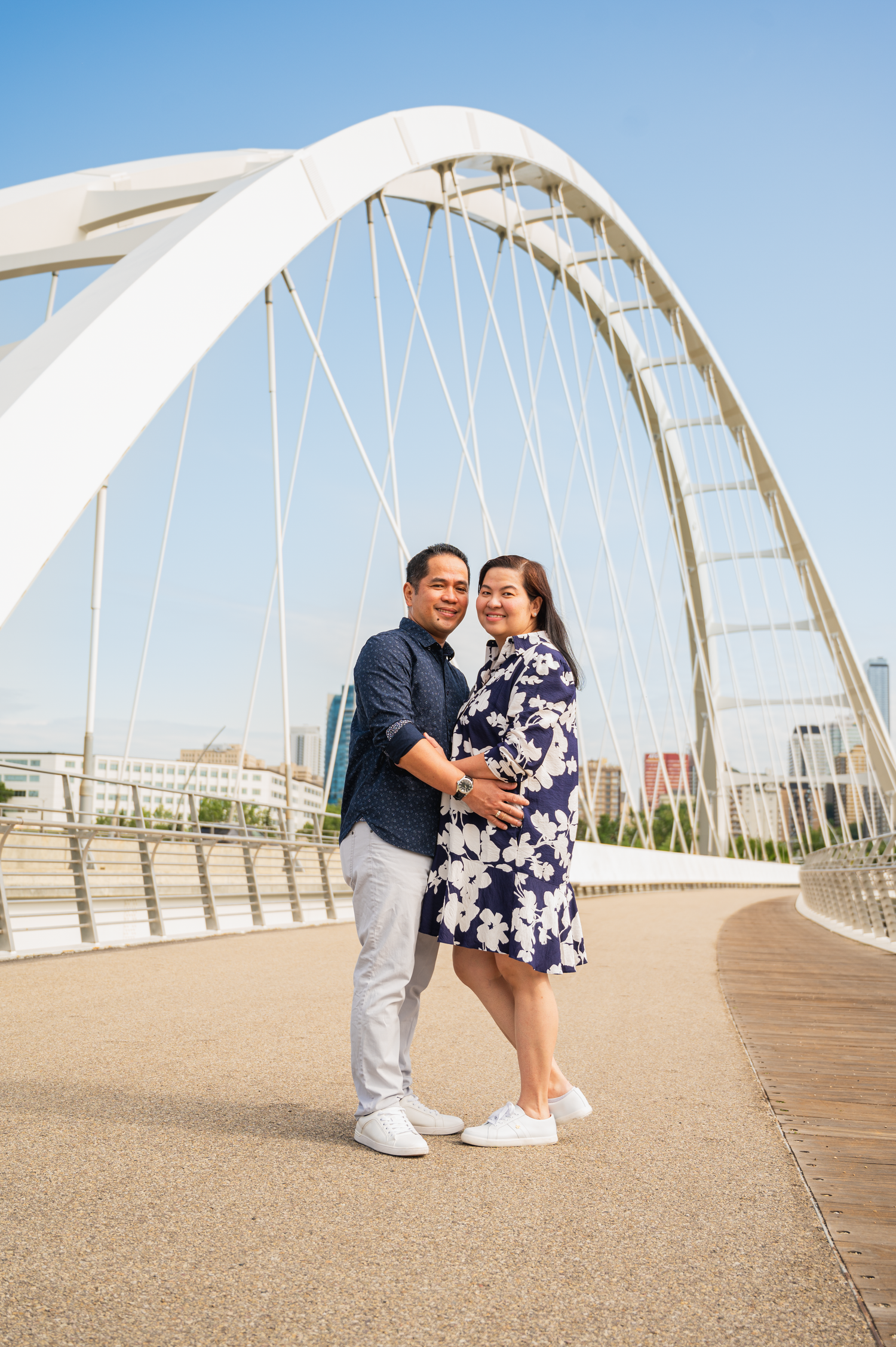 A couple embracing during a summer session in Edmonton.