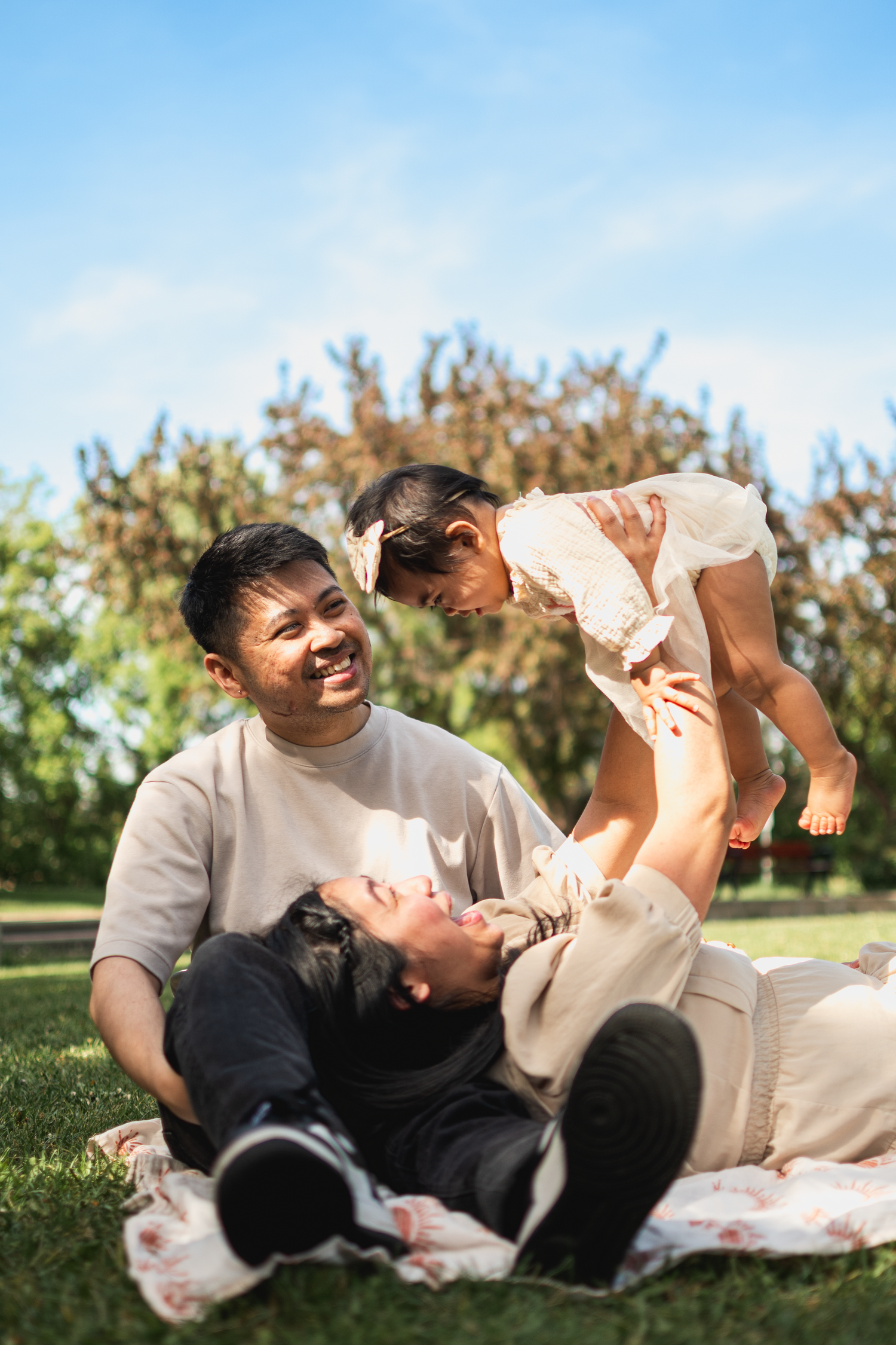 Parents holding their newborn baby during a lifestyle session in Edmonton.

For the upcoming 1 year old birthday