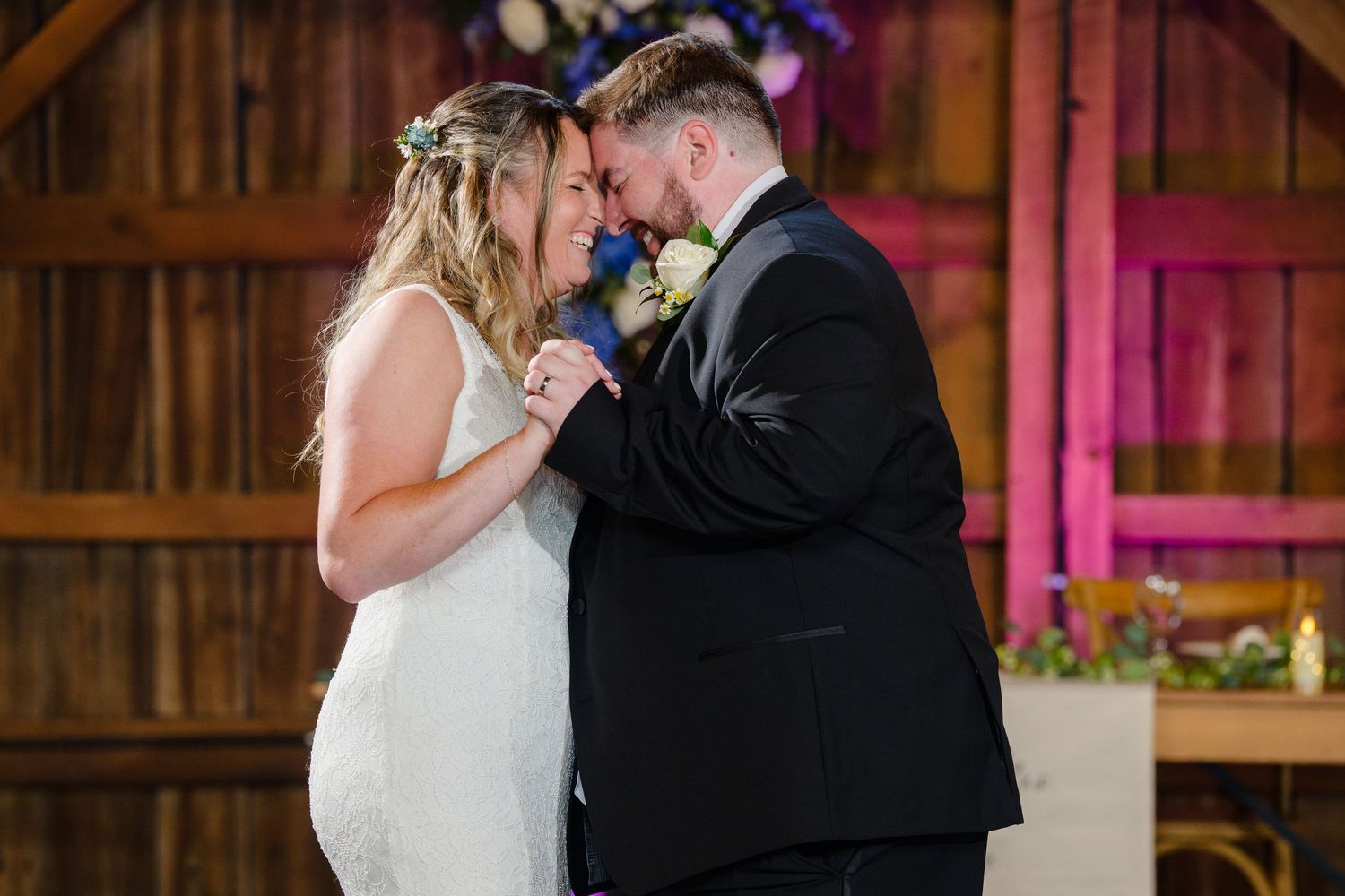 Bride and Groom laughing while dancing during their wedding reception at Haymaker's Mill 1875 in North Canton Ohio