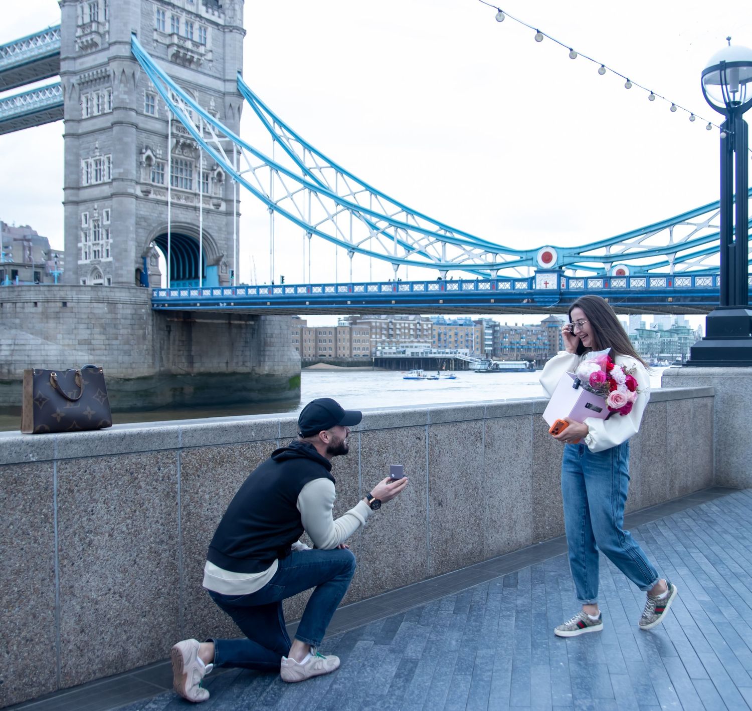Surprise proposal by Tower Bridge in London, photographed by GGC Photography