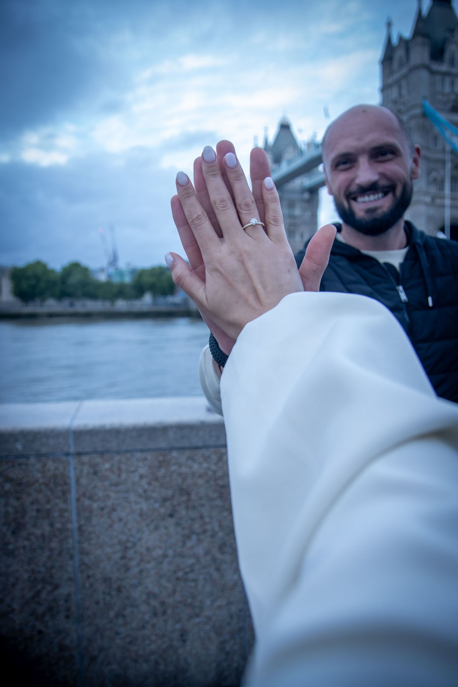 Surprise proposal by Tower Bridge in London, photographed by GGC Photography