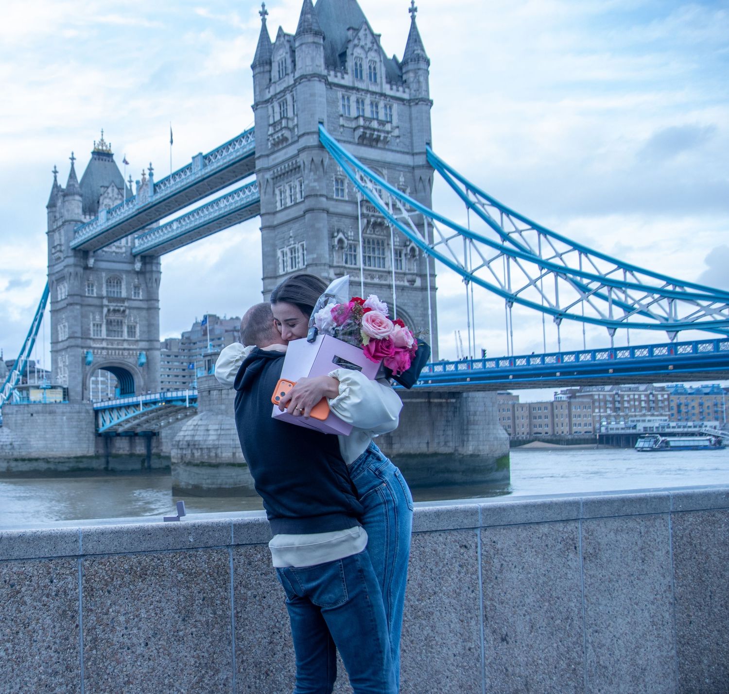 Surprise proposal by Tower Bridge in London, photographed by GGC Photography