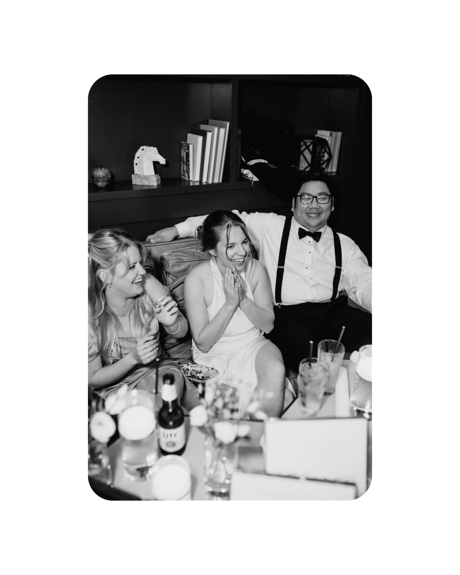 Black and white vintage photographs showing guests enjoying a formal dinner event at a restaurant table.