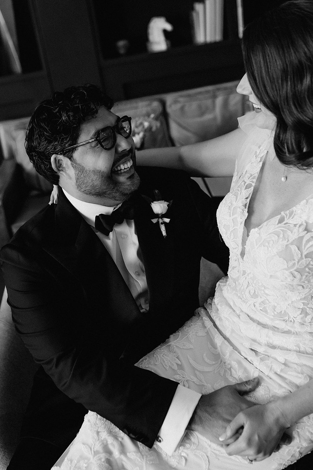 A romantic black and white photo sequence shows a couple in wedding attire sharing intimate moments together.