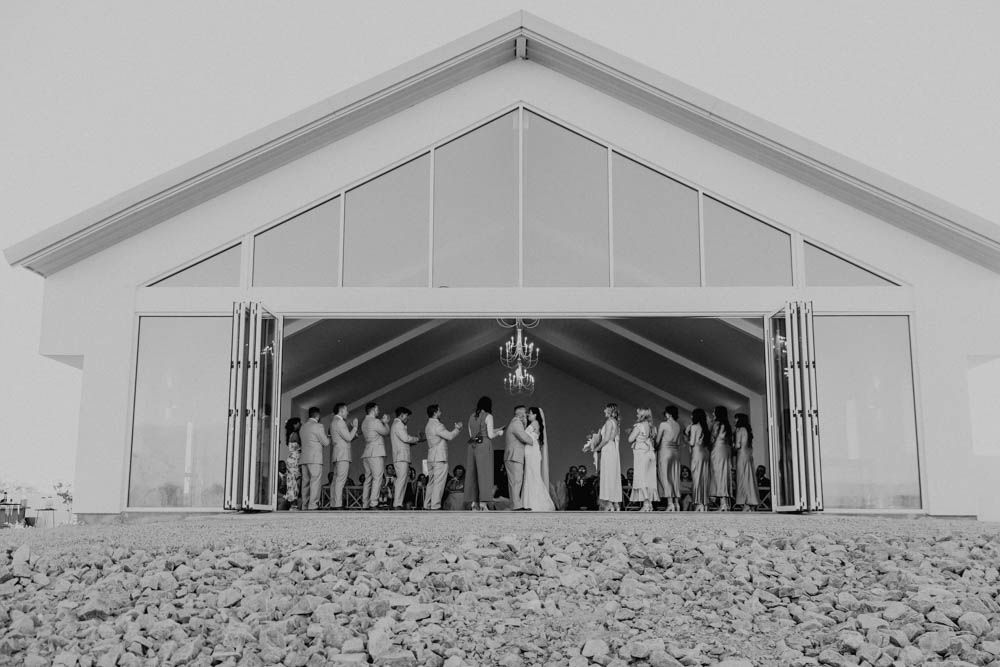 A black and white photo series shows a church tent revival meeting with rows of people gathering under a large tent.