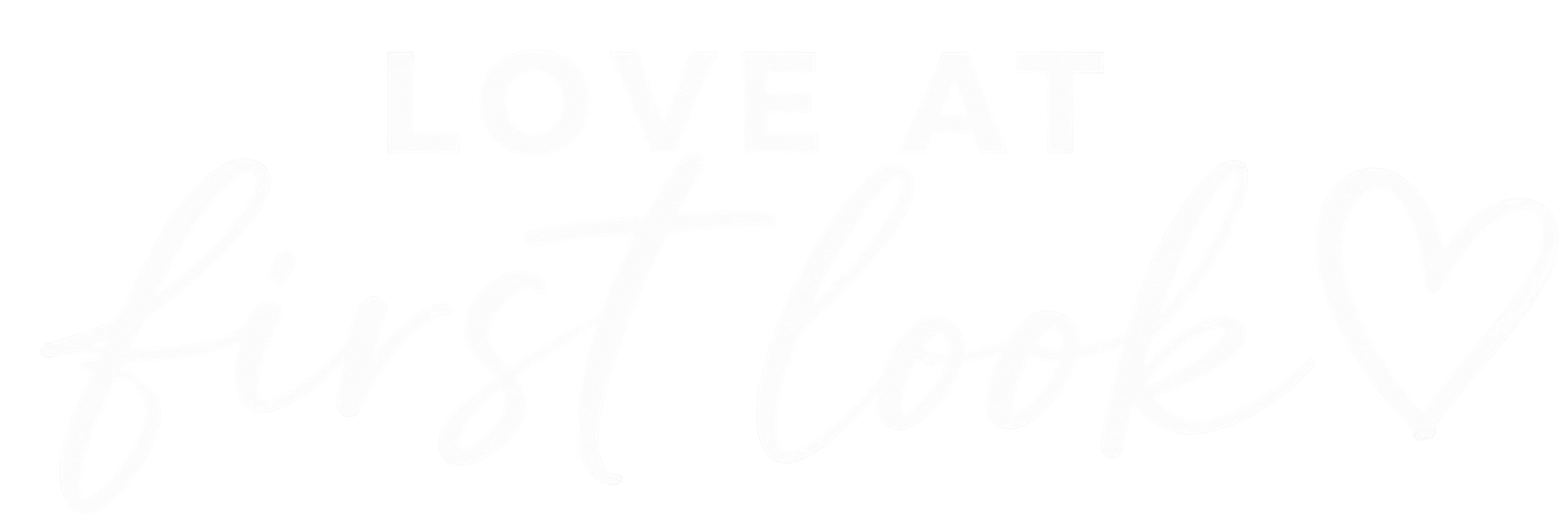 Elegant cursive script logo in white on a light background.