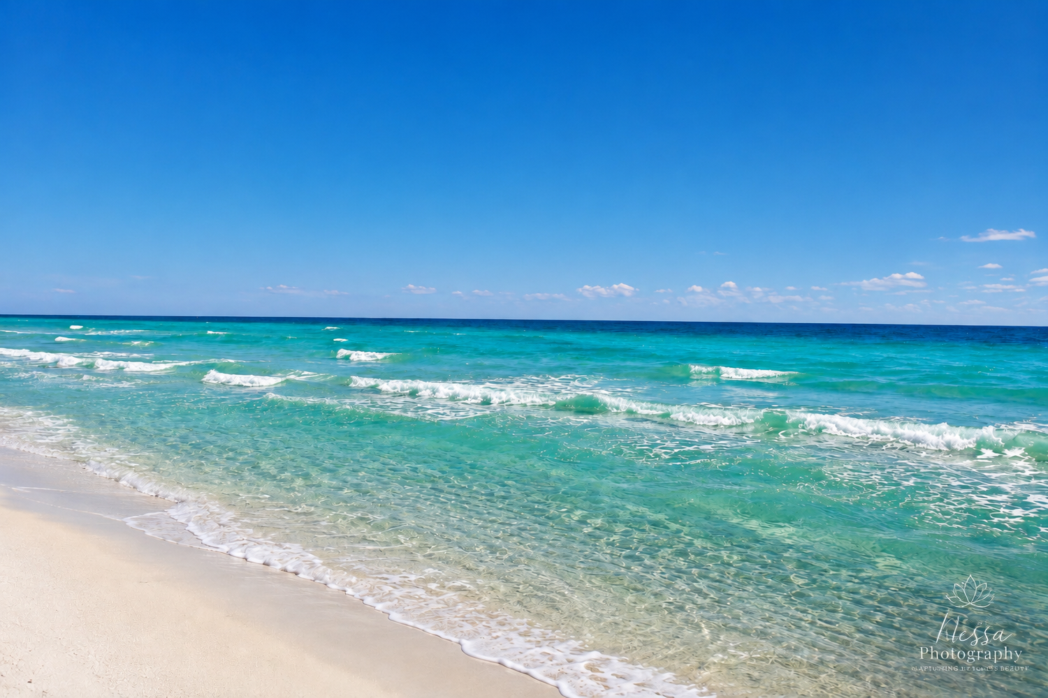 Turquoise beach
Turquoise ocean waves meeting a pale sandy beach beneath a clear blue sky.