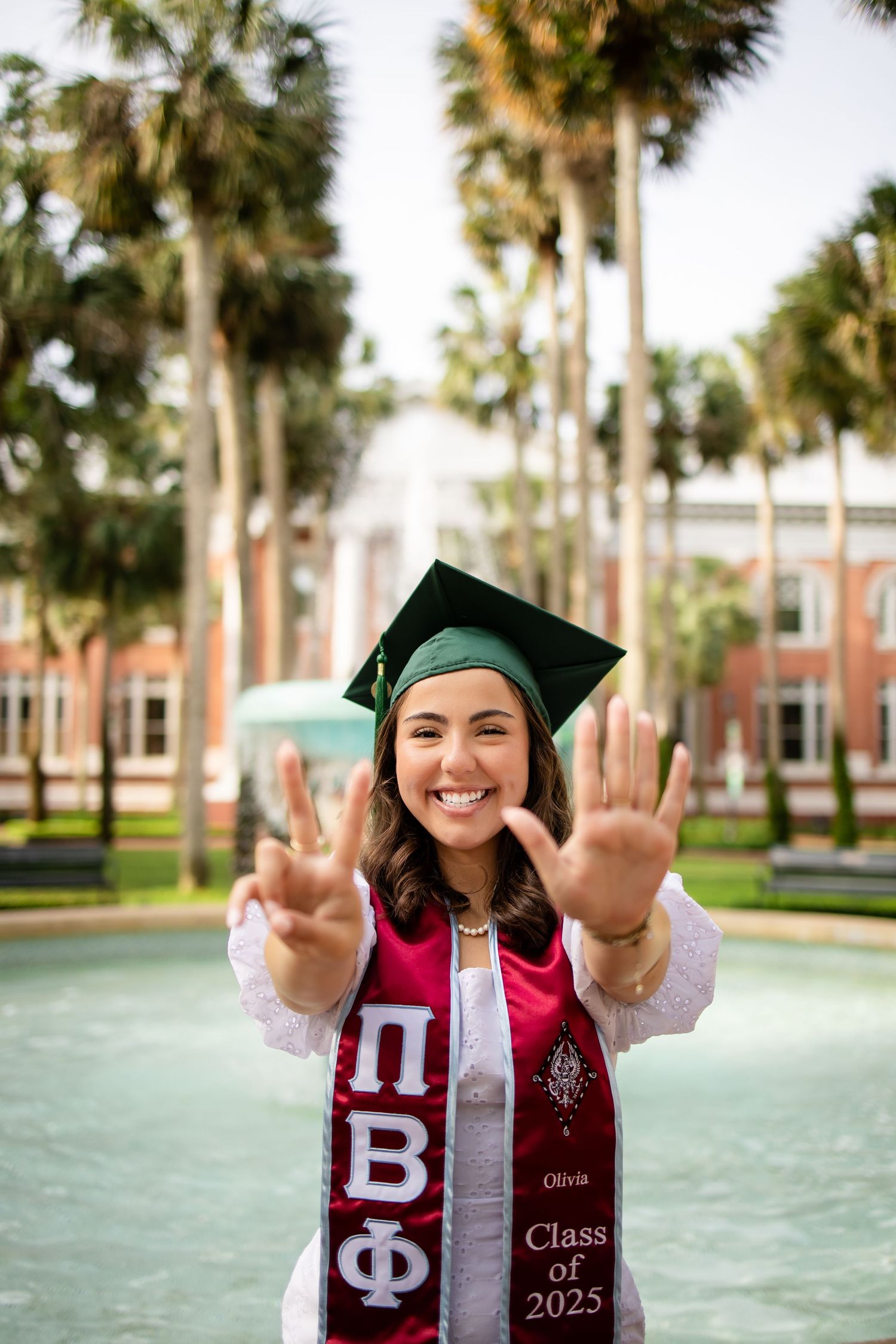 A graduation photo sequence showing someone in cap and gown doing a U-F-L hand gesture formation with palm movements.