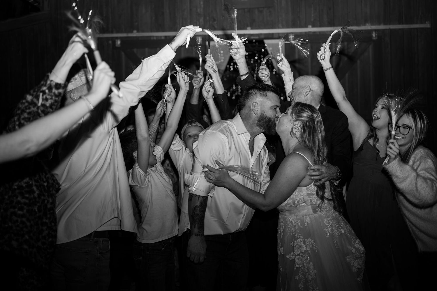 Black and white photos of people dancing with their hands raised at what appears to be a party or celebration event.