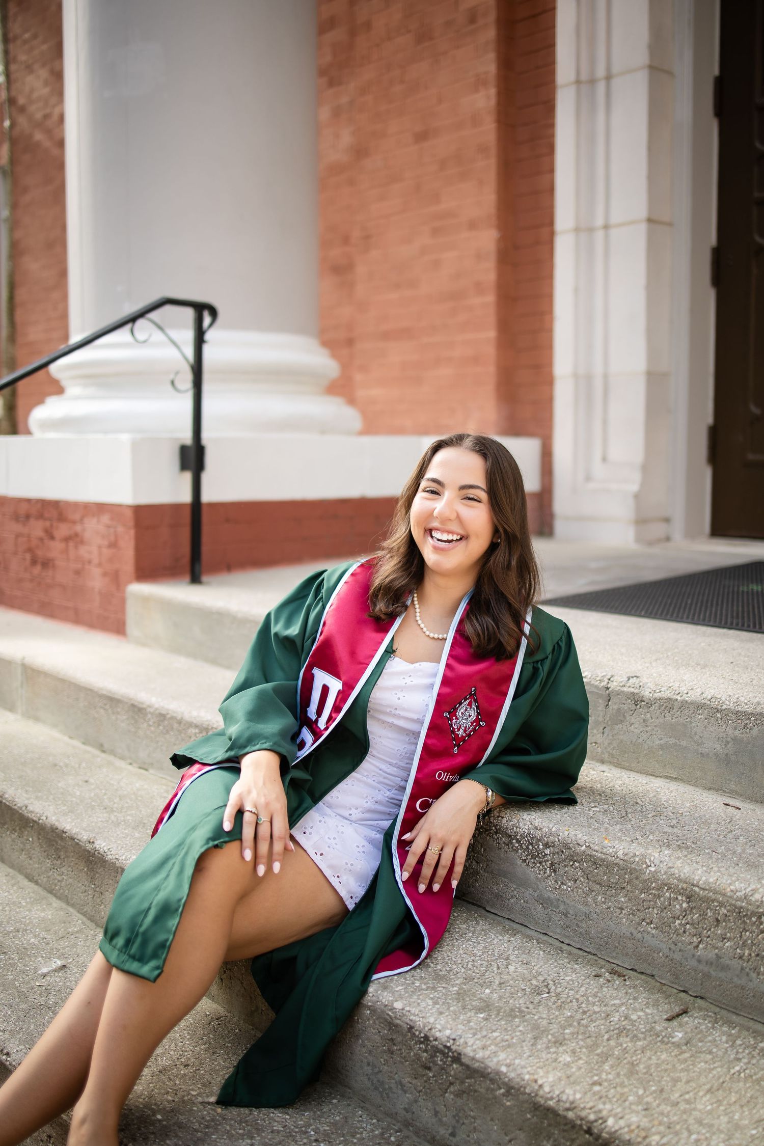 Collage of graduation photos showing someone in a green gown and varsity jacket sitting on concrete steps.