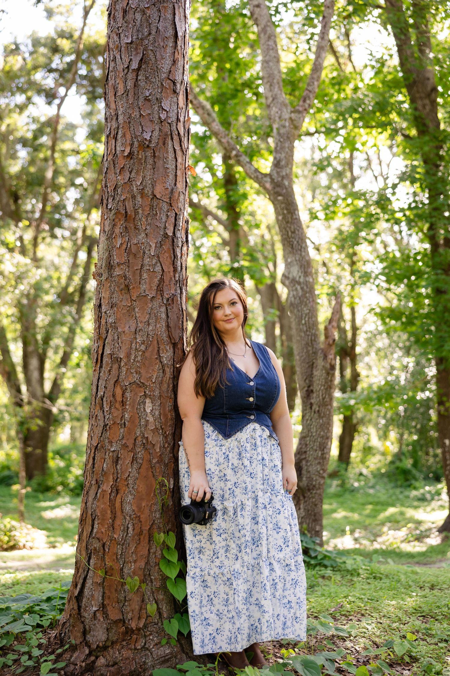 A series of photographs taken in a sunlit forest featuring casual summer fashion against tall pine trees.