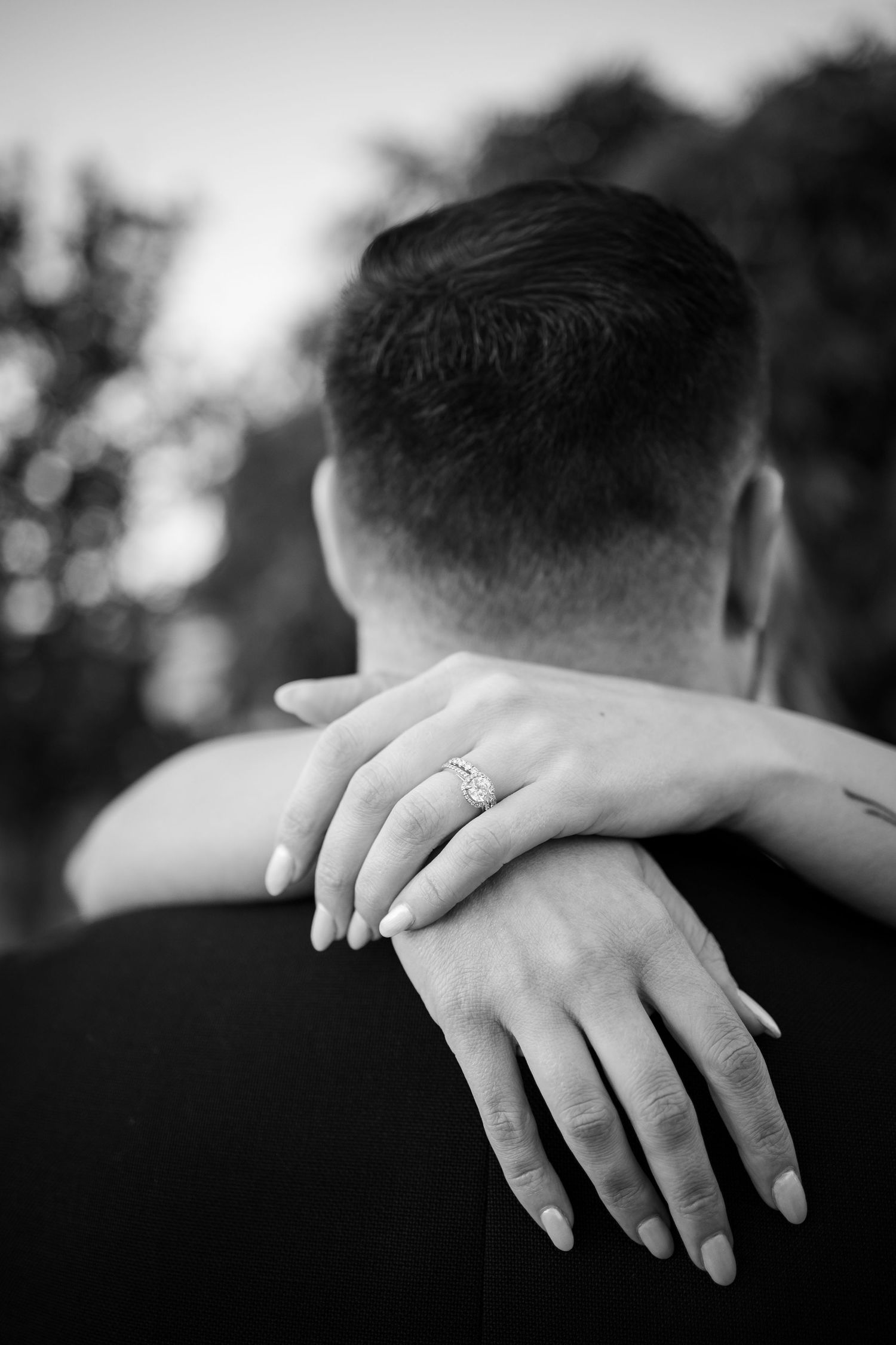 Black and white close-up photo series showing wedding rings on hands in different artistic poses and angles.