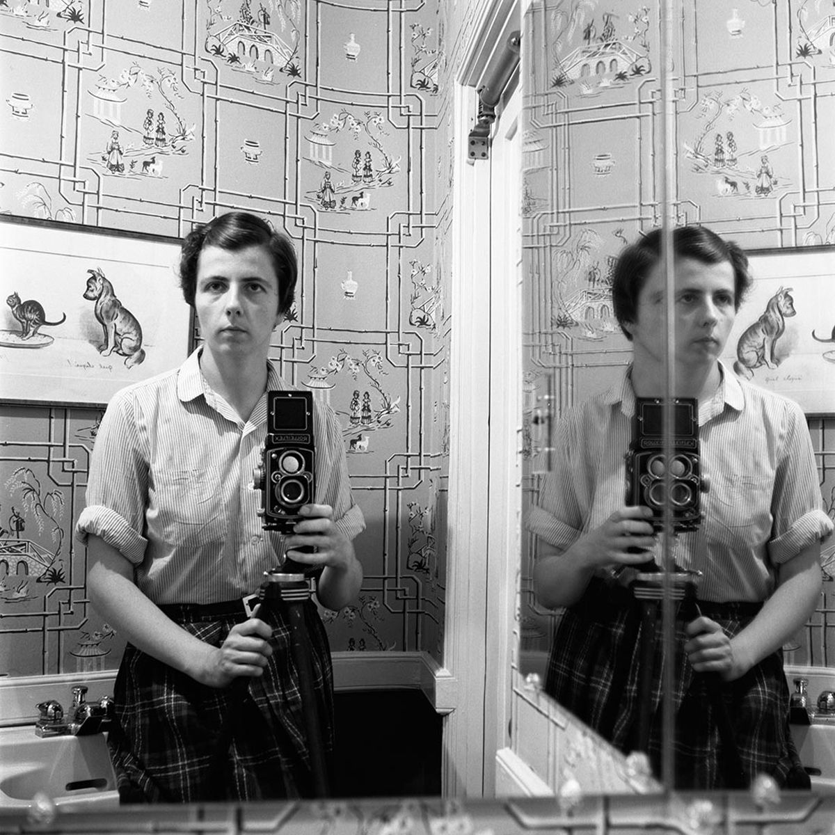 A black and white montage of multiple self-portrait photographs taken with vintage cameras in a mirrored reflection.