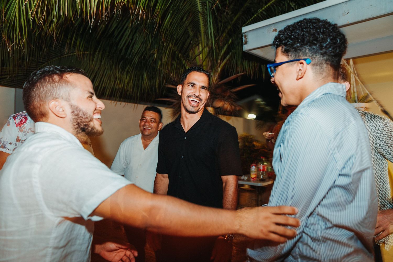 Group of friends sharing laughs during casual gathering.