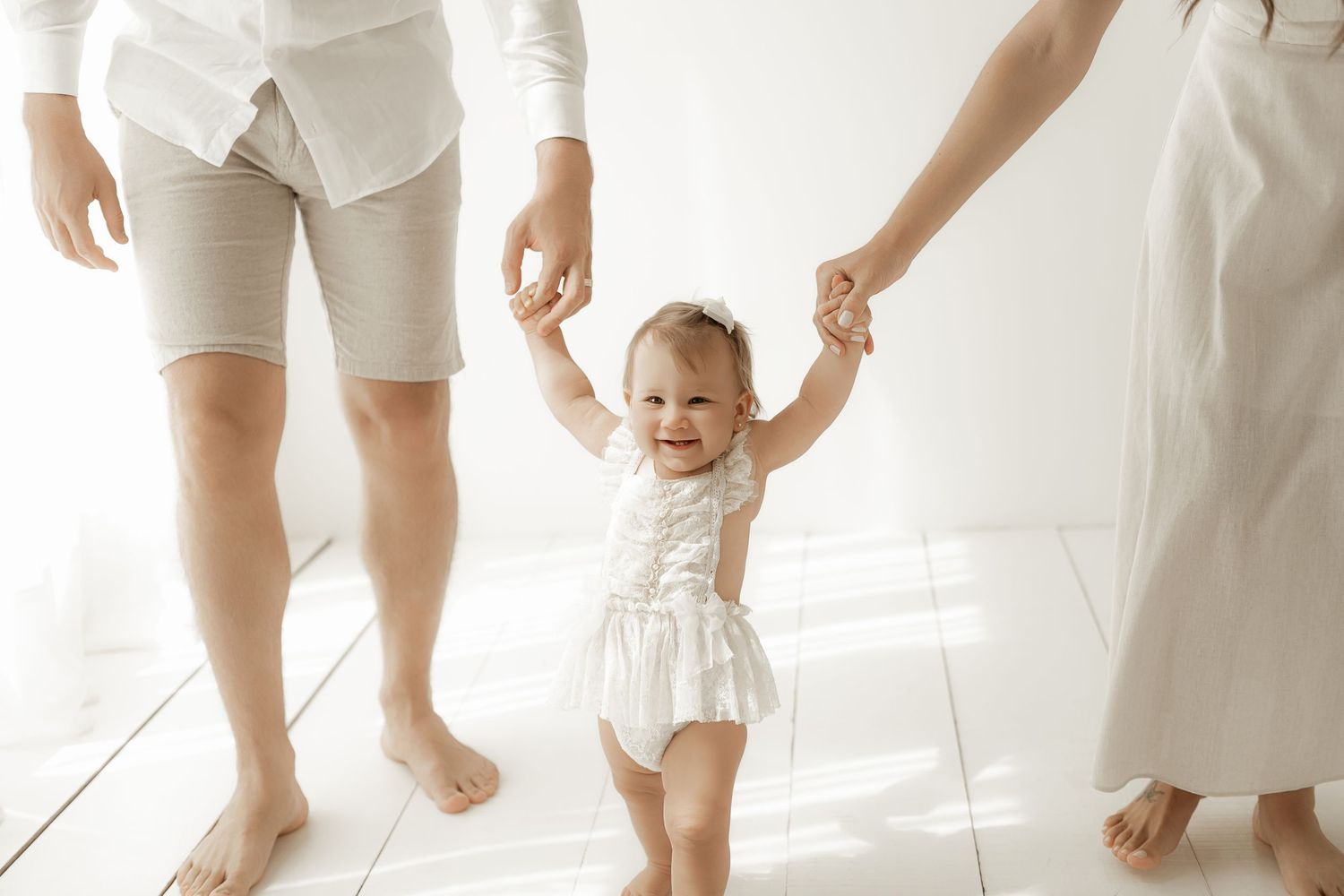 A series of cropped photos showing bare feet and legs of people in white clothing against a light background.