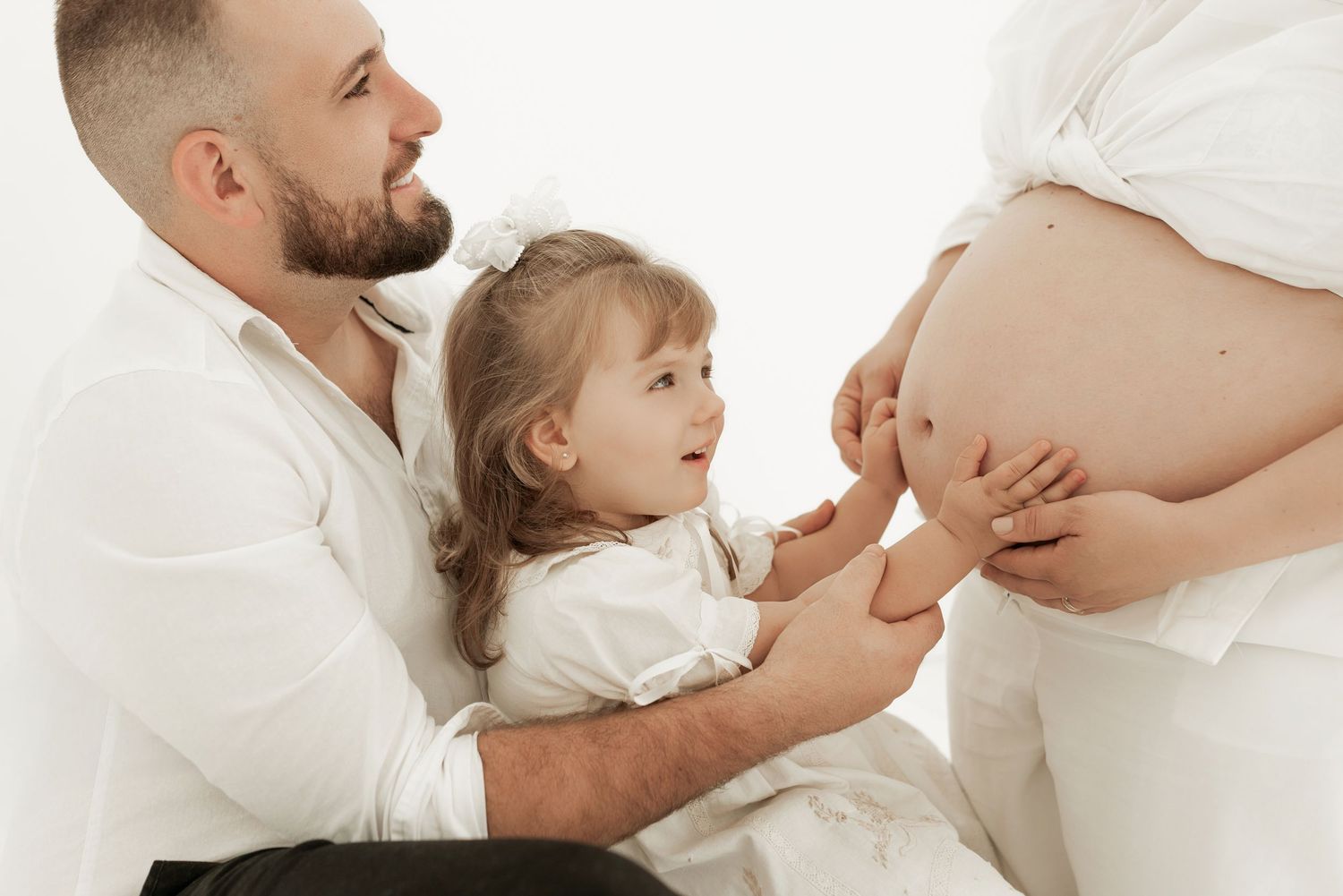 A tender family moment captured in a series of black and white photos showing parent and child interactions.
