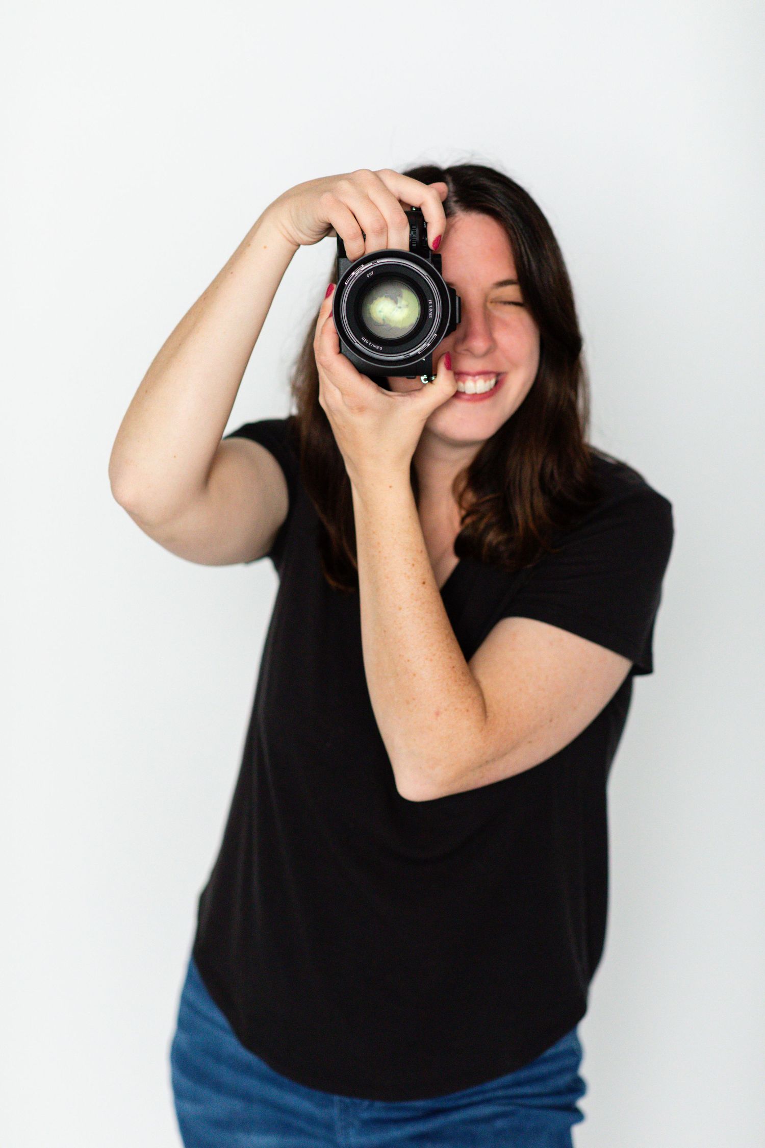 Erie, PA Pennsylvania photographer holds up camera
