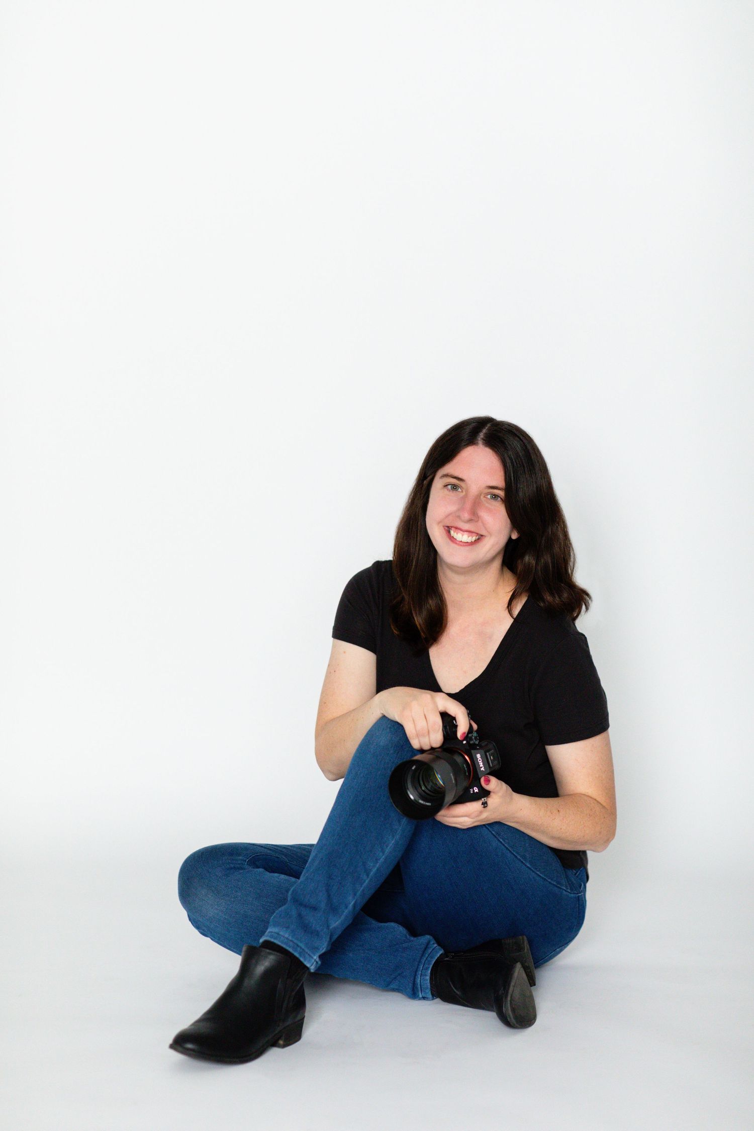Erie, PA Pennsylvania photographer poses with camera