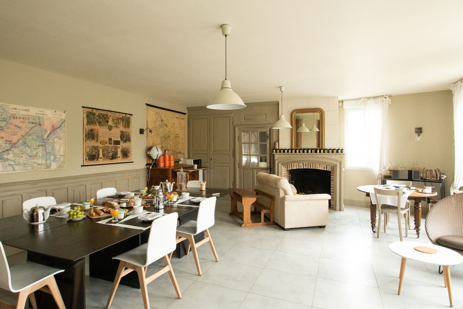 Spacious minimalist living area with modern furniture and natural lighting.
