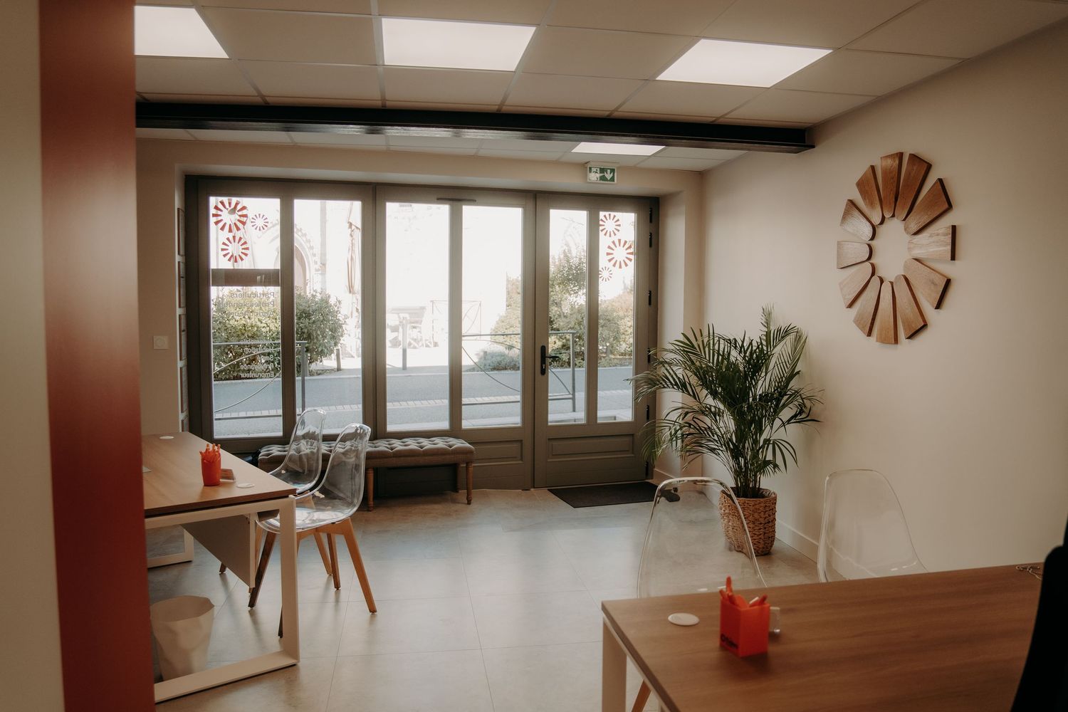 Modern office space interior with fluorescent lighting and minimalist furniture.