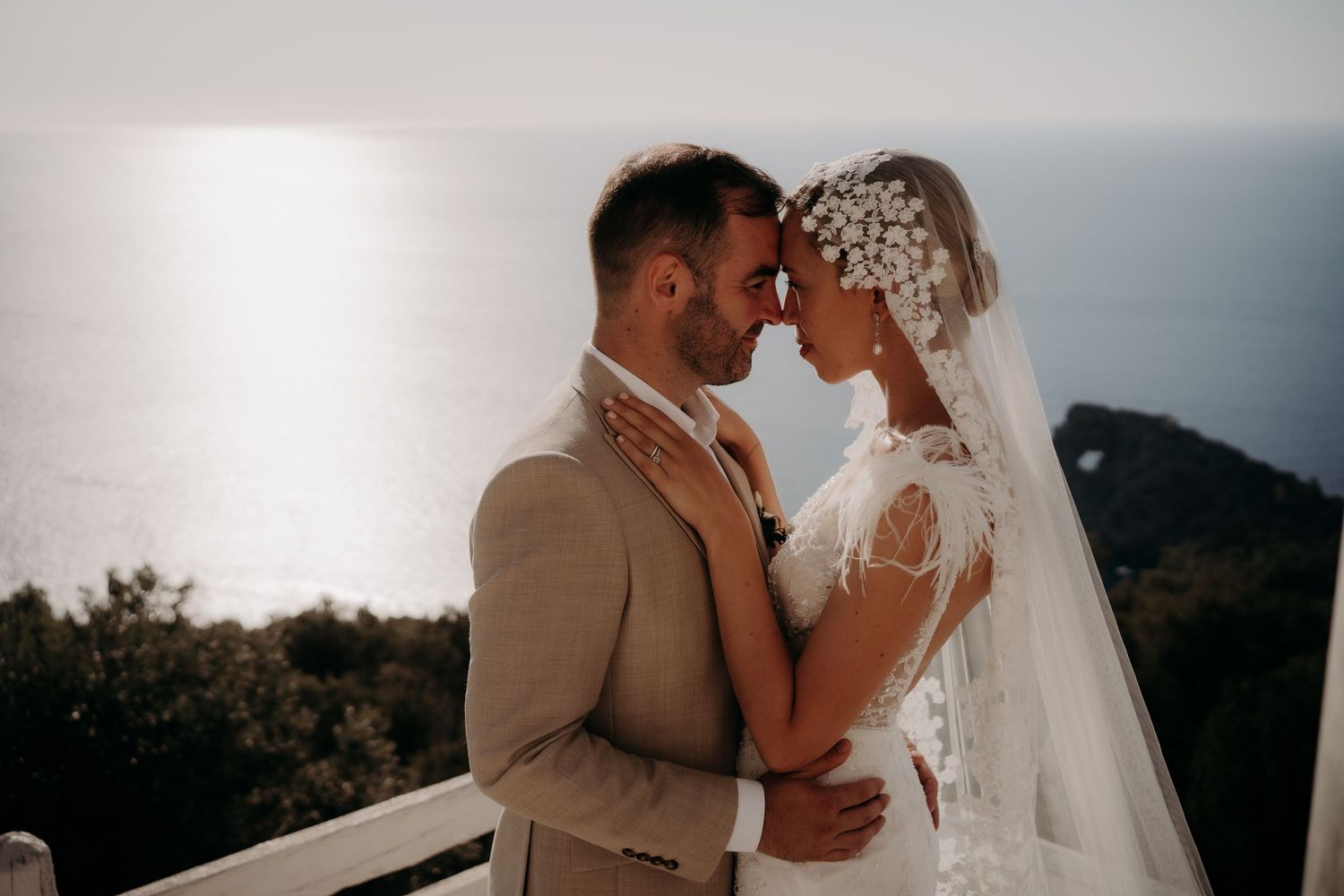 Intimate wedding moment photographed against a scenic mountain backdrop.