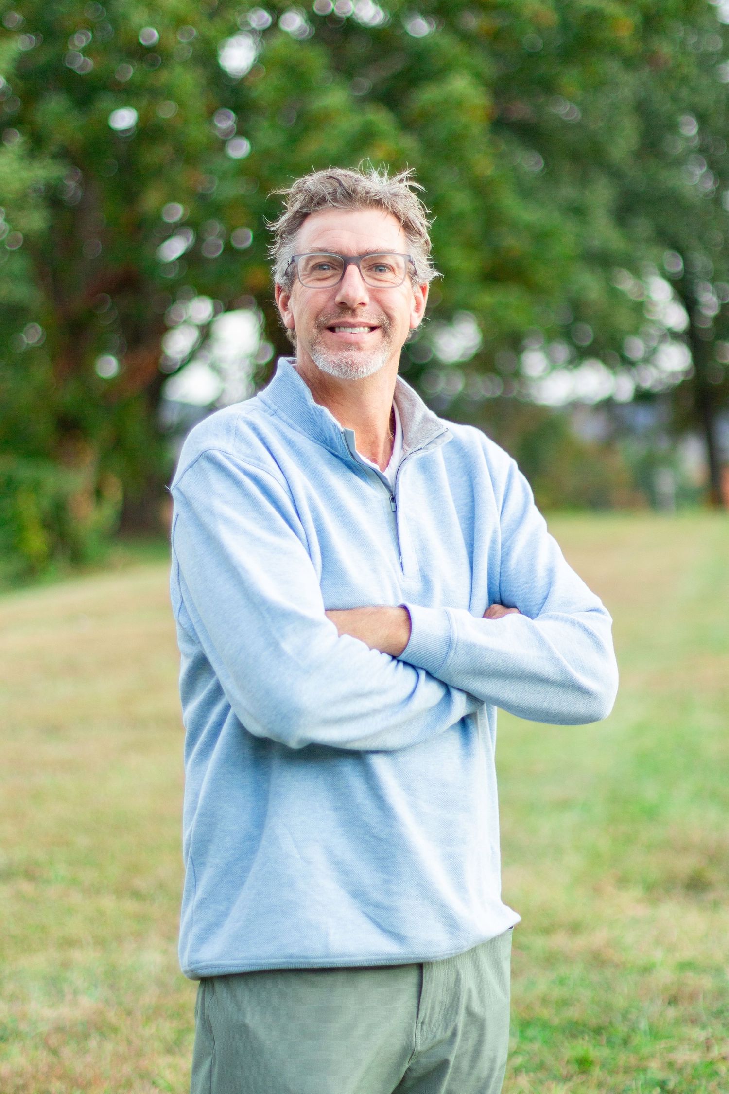 Man smiling at the camera for a business headshot
