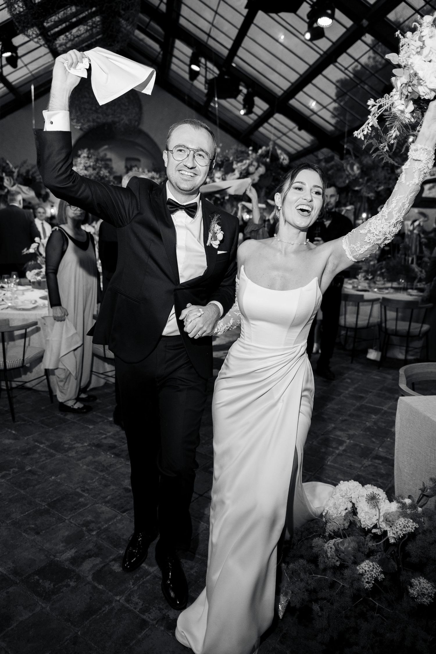 Black and white reception photos capturing joyful dancing moments at wedding celebration.