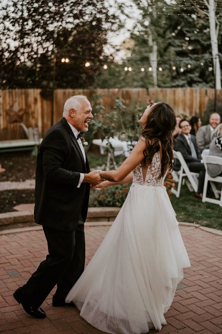 Bride sharing an emotional dance with her dad on her wedding day.