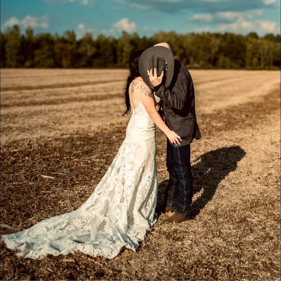 Romantic sunset portrait of a bride and groom celebrating their wedding day together.