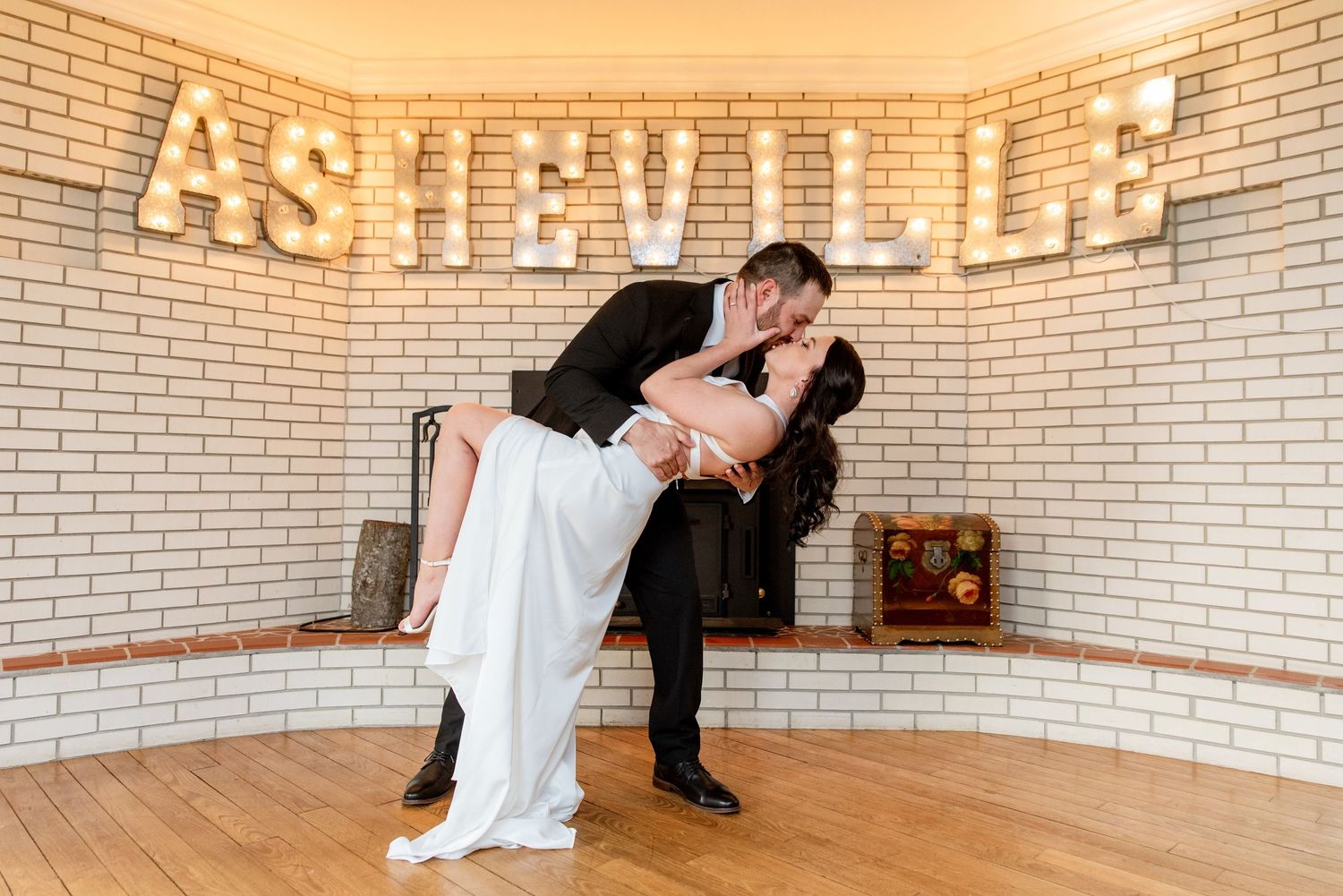 Romantic moment of a bride and groom kissing on their wedding day.