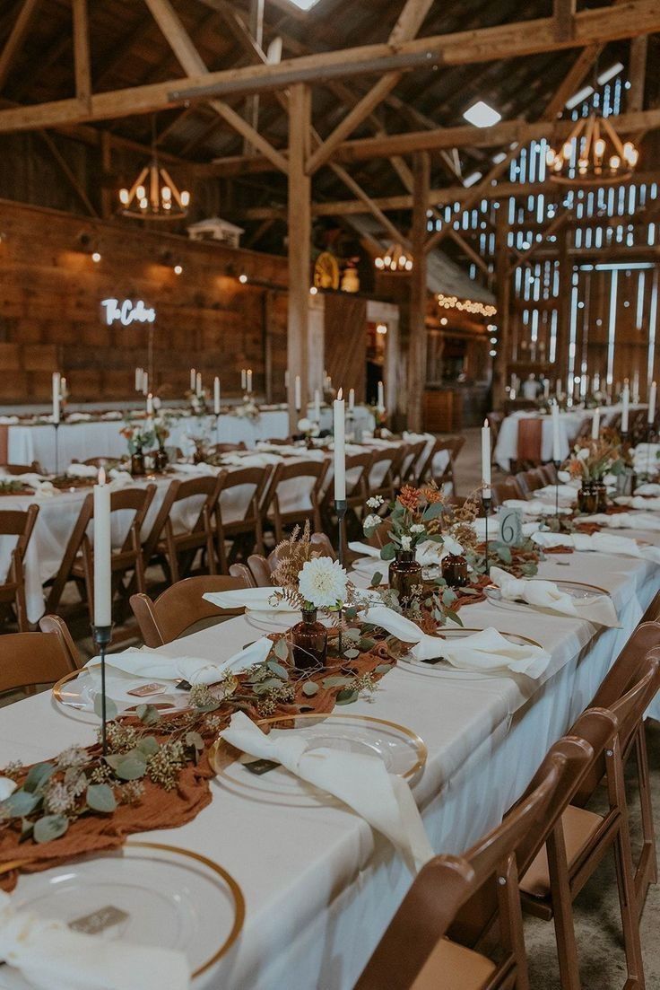 Wedding reception details including escort cards, table numbers, and romantic candlelight decor.