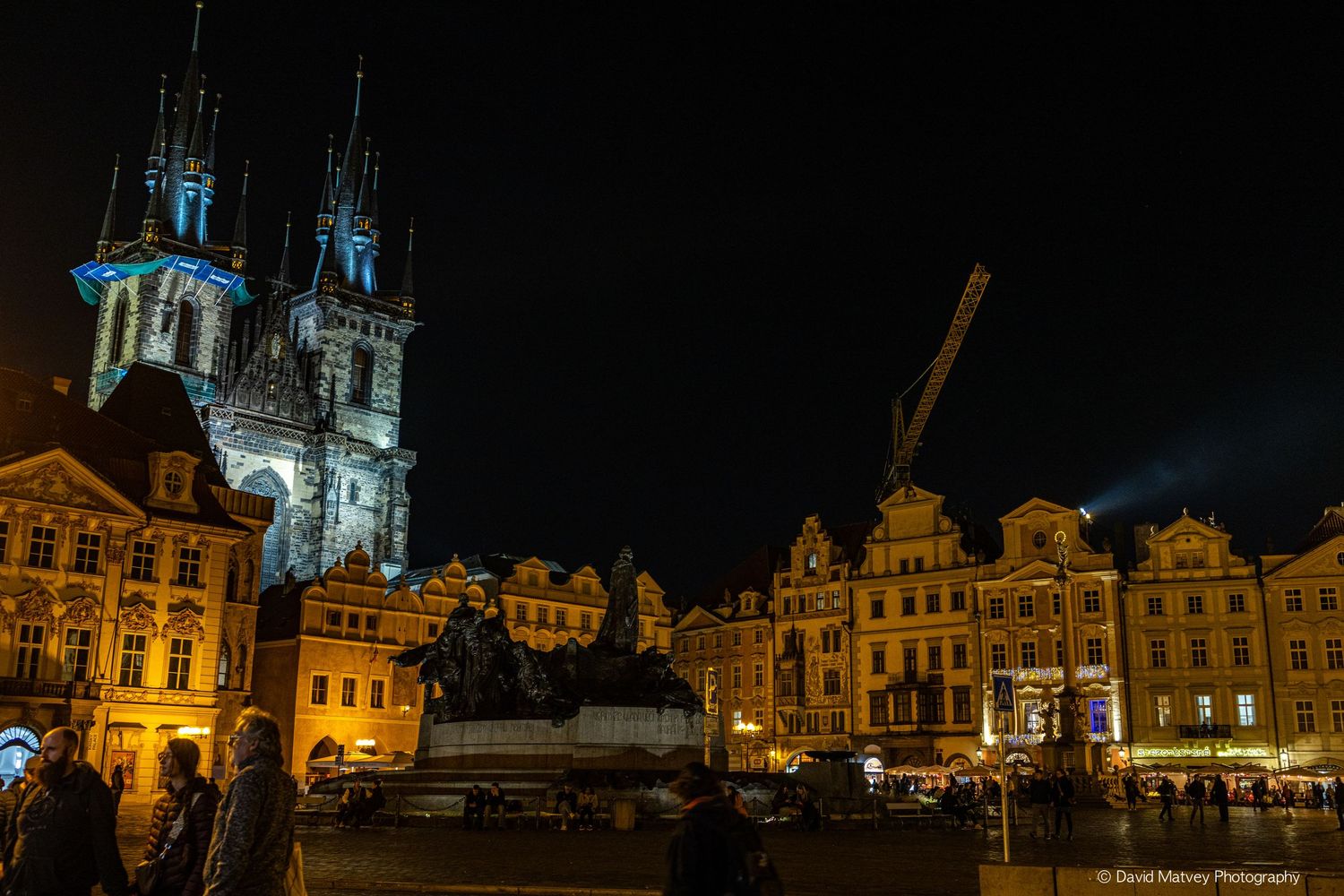 Prague Old Town Square illuminated at night with Church of Our Lady.