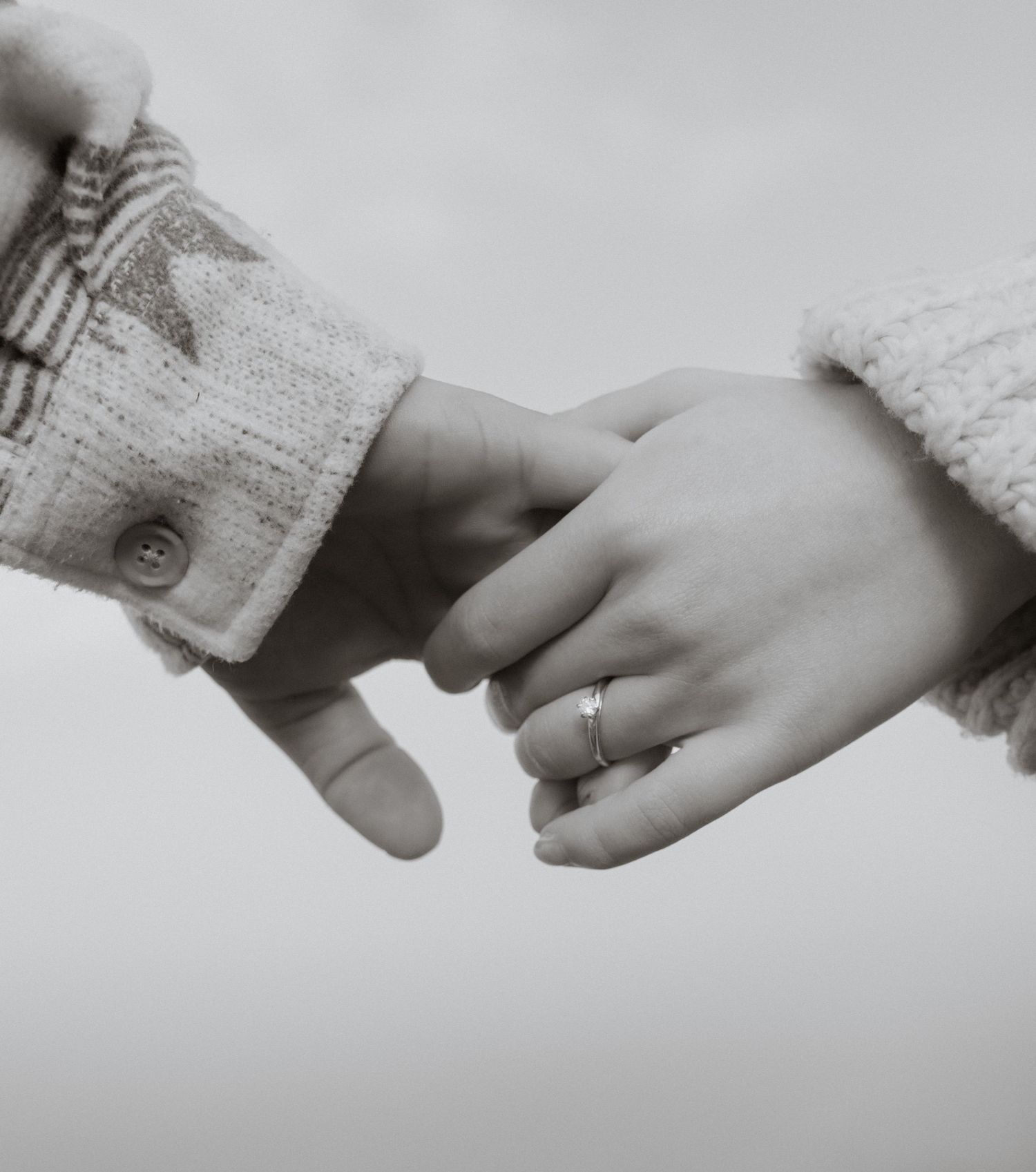 An engaged couple holding hands during a couples session in West Glacier Montana