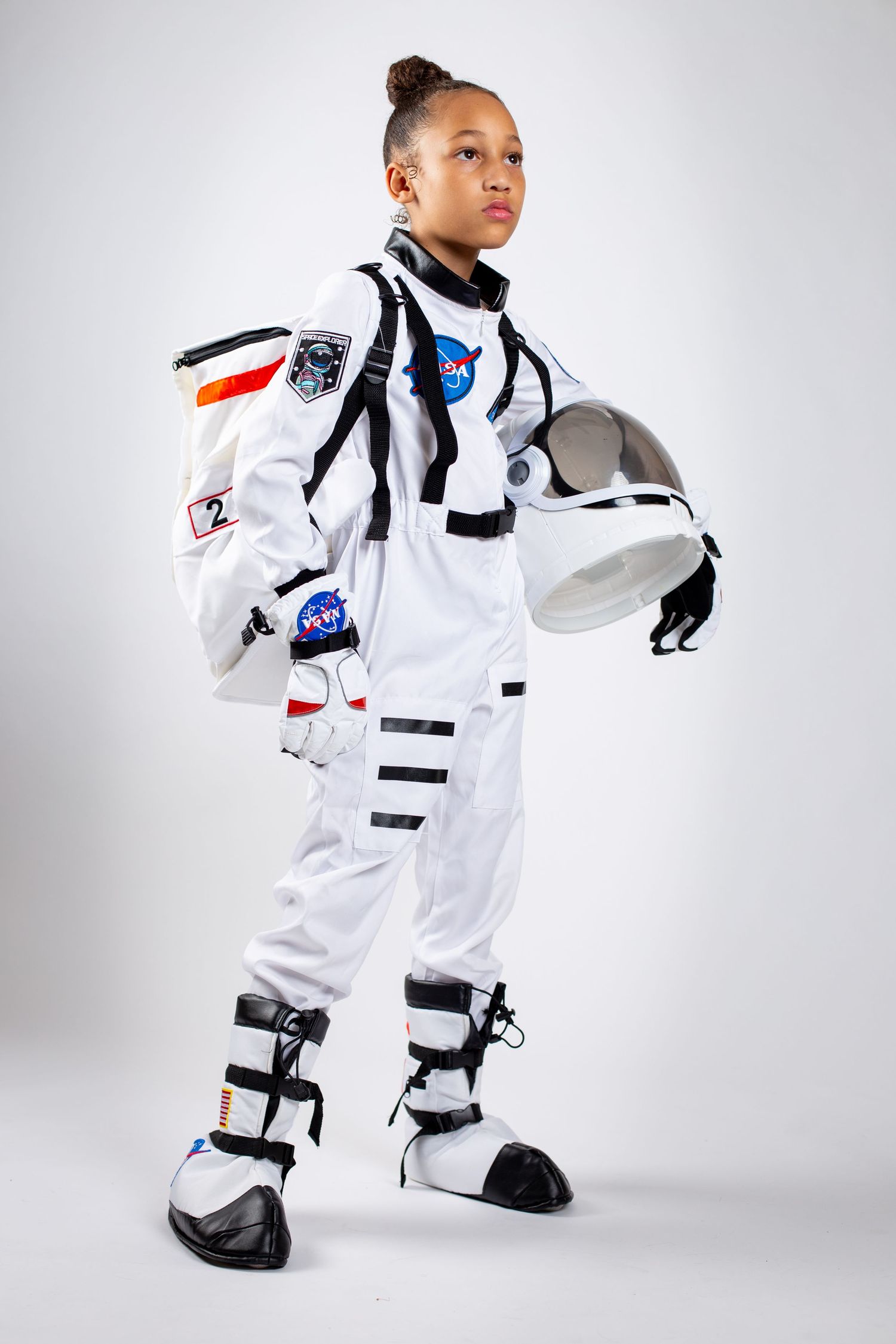 Collage of white NASA astronaut space suit costumes for kids shown from different angles with official patches and details.