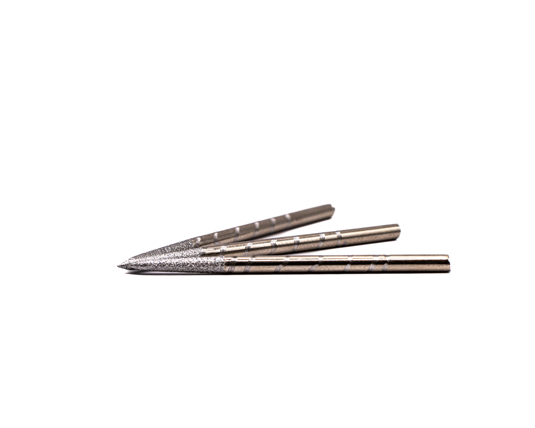 Three stainless steel broadhead arrow tips with sharp blades displayed on a white background.