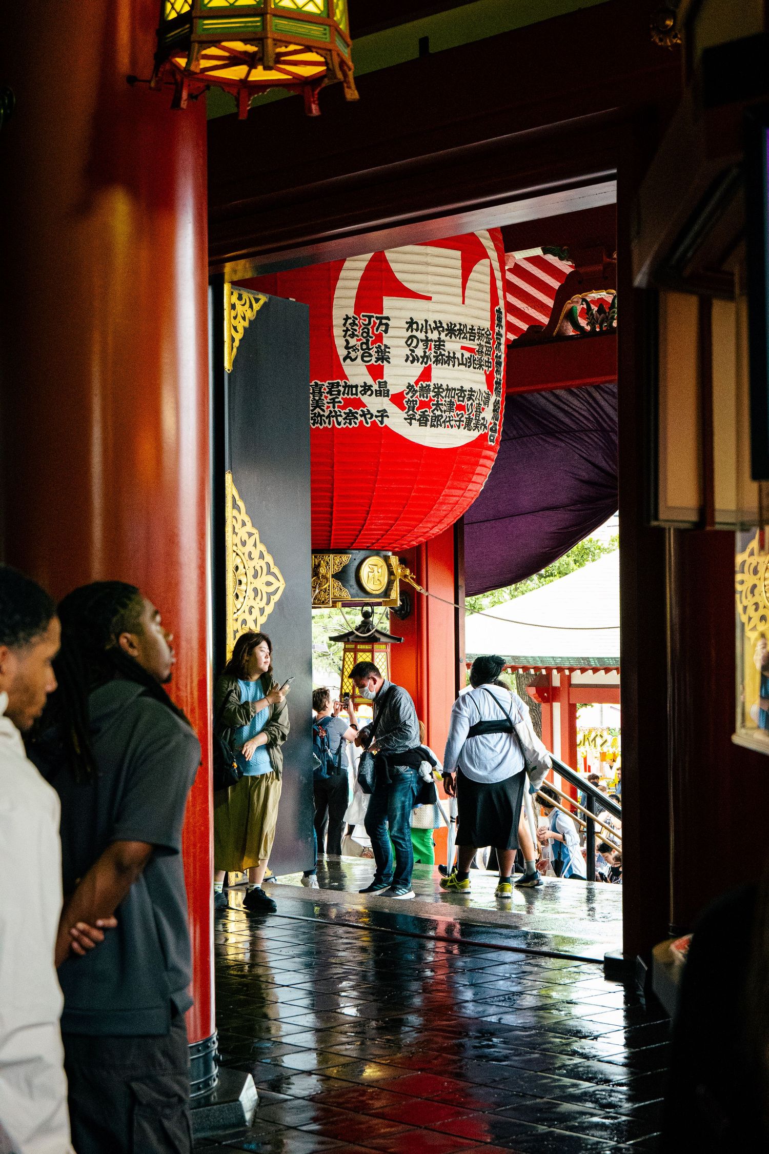 A close-up view of a traditional Japanese lantern with Japanese text.