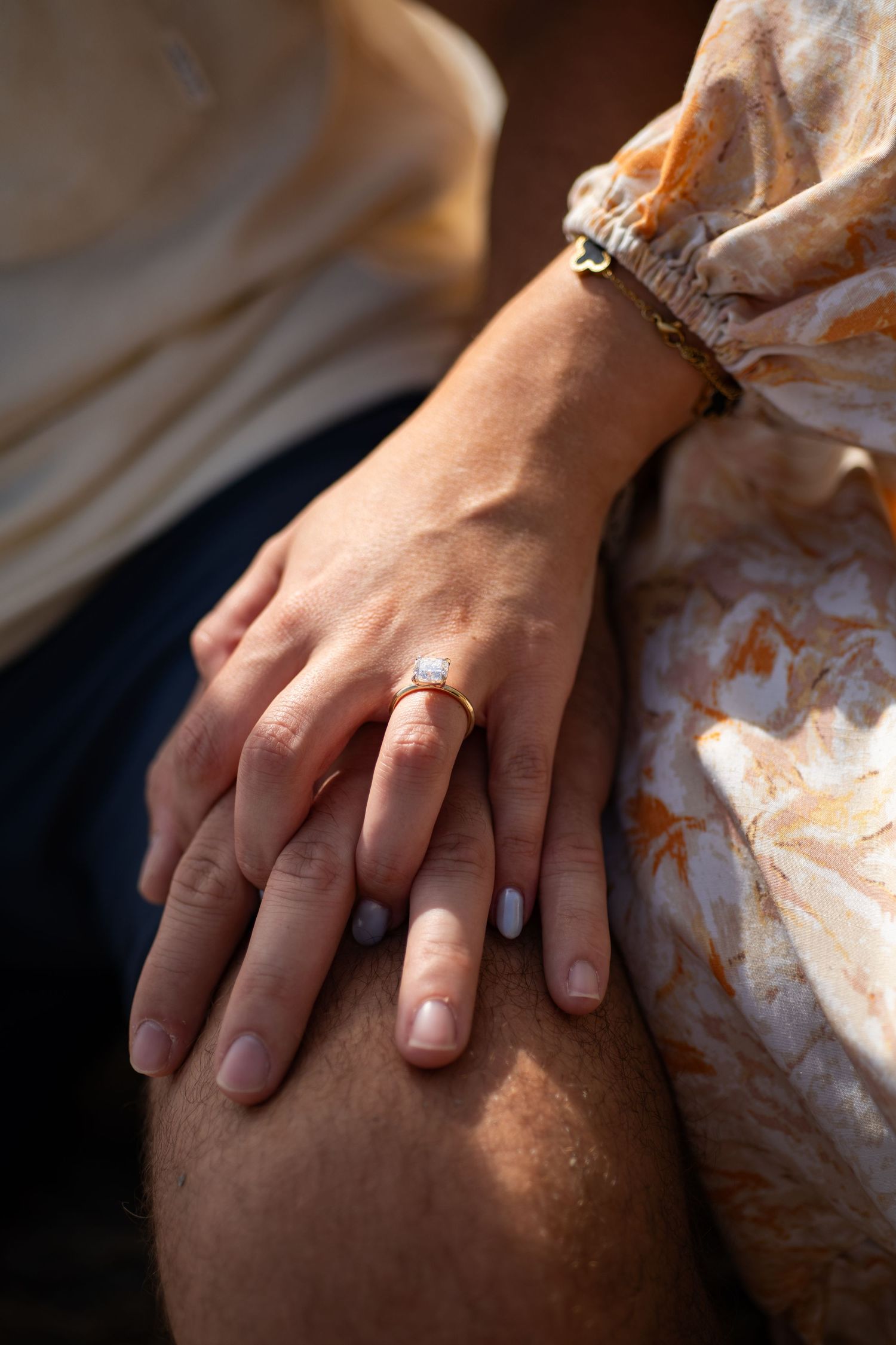 Close-up of engagement ring during proposal session.