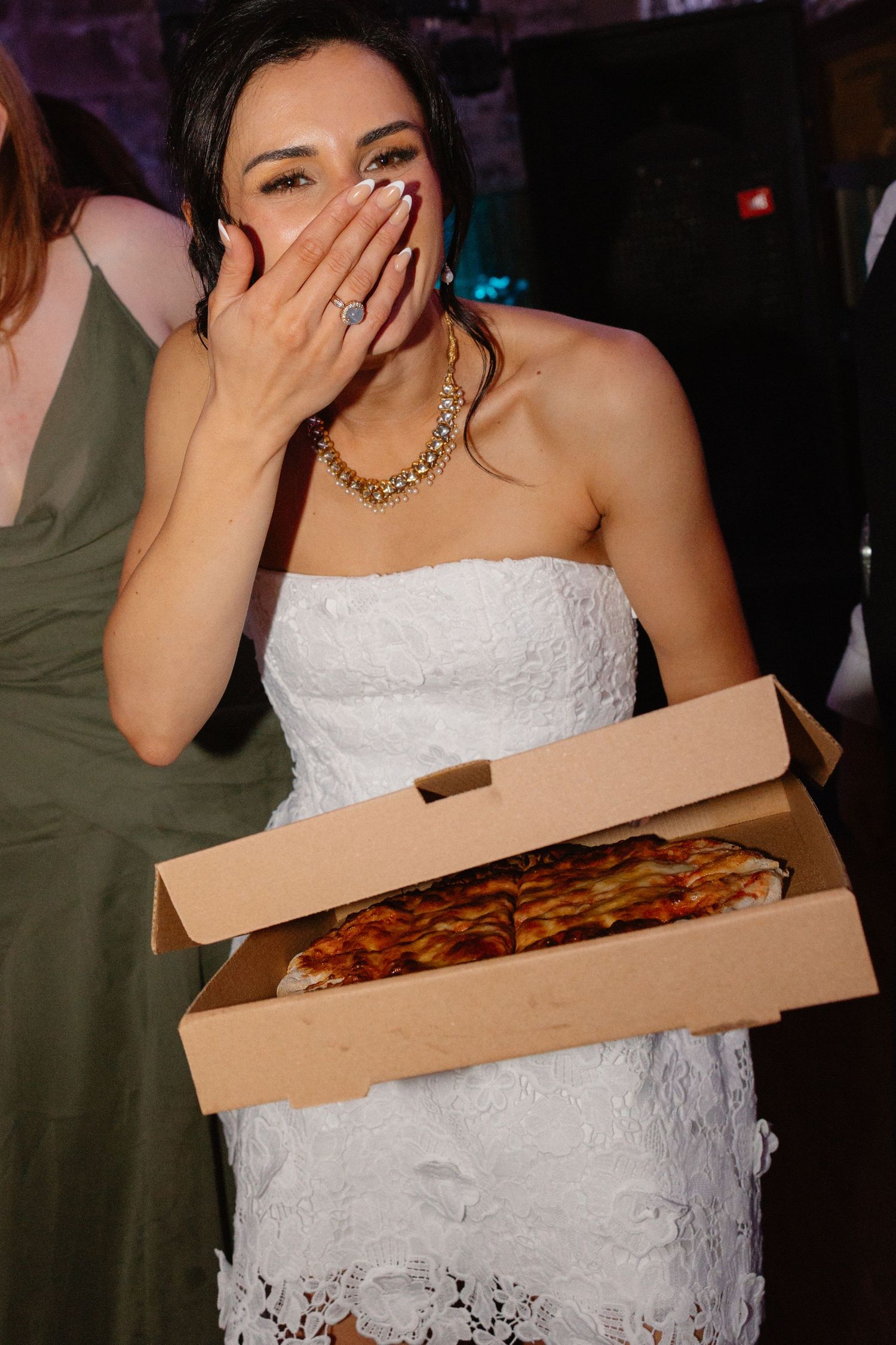 Party, bride with pizza wedding at Rosebery Steading, Temple, Gorebridge, Scotland.