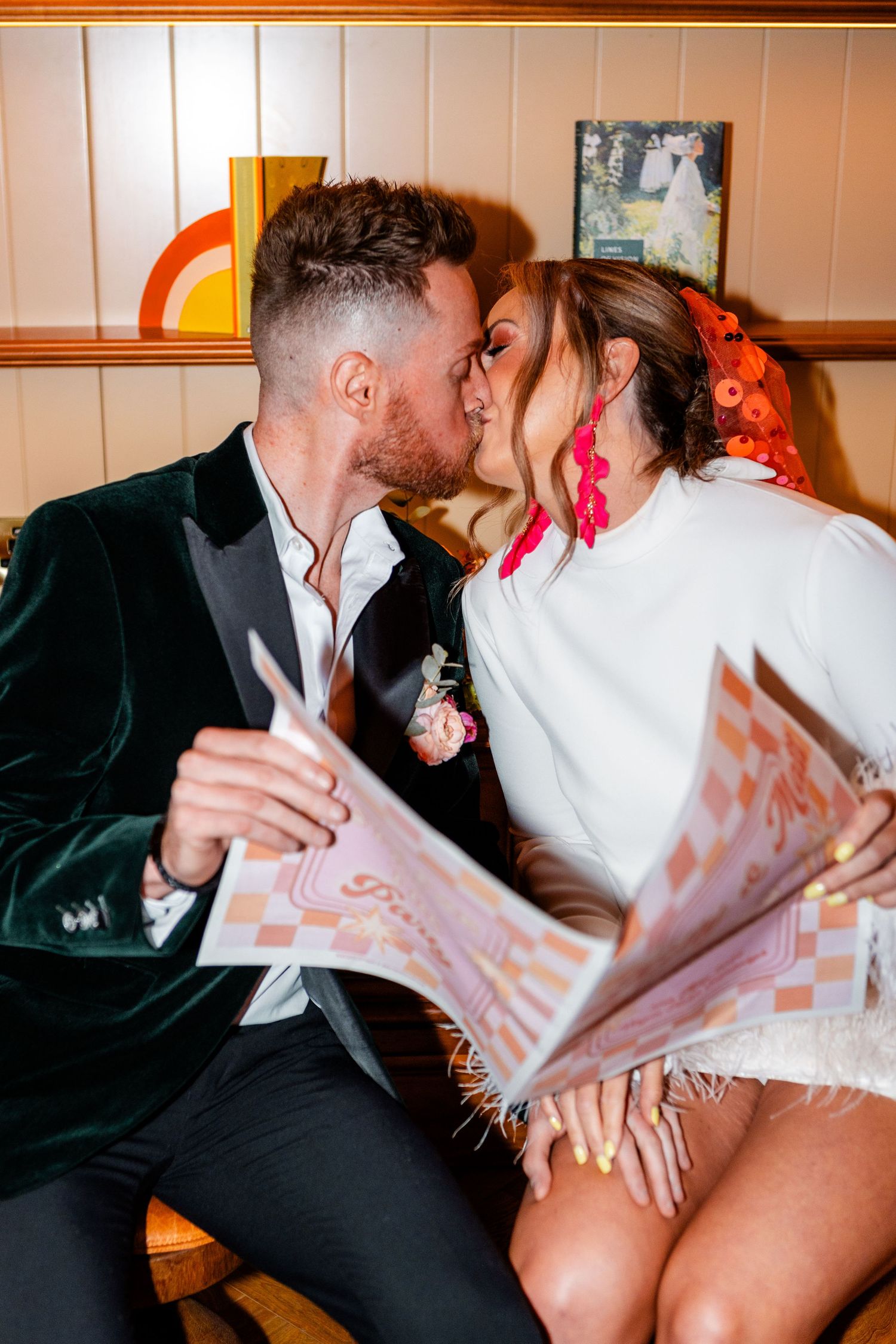 Playful sequence of a couple sharing an intimate moment with a confetti veil during their wedding celebration.