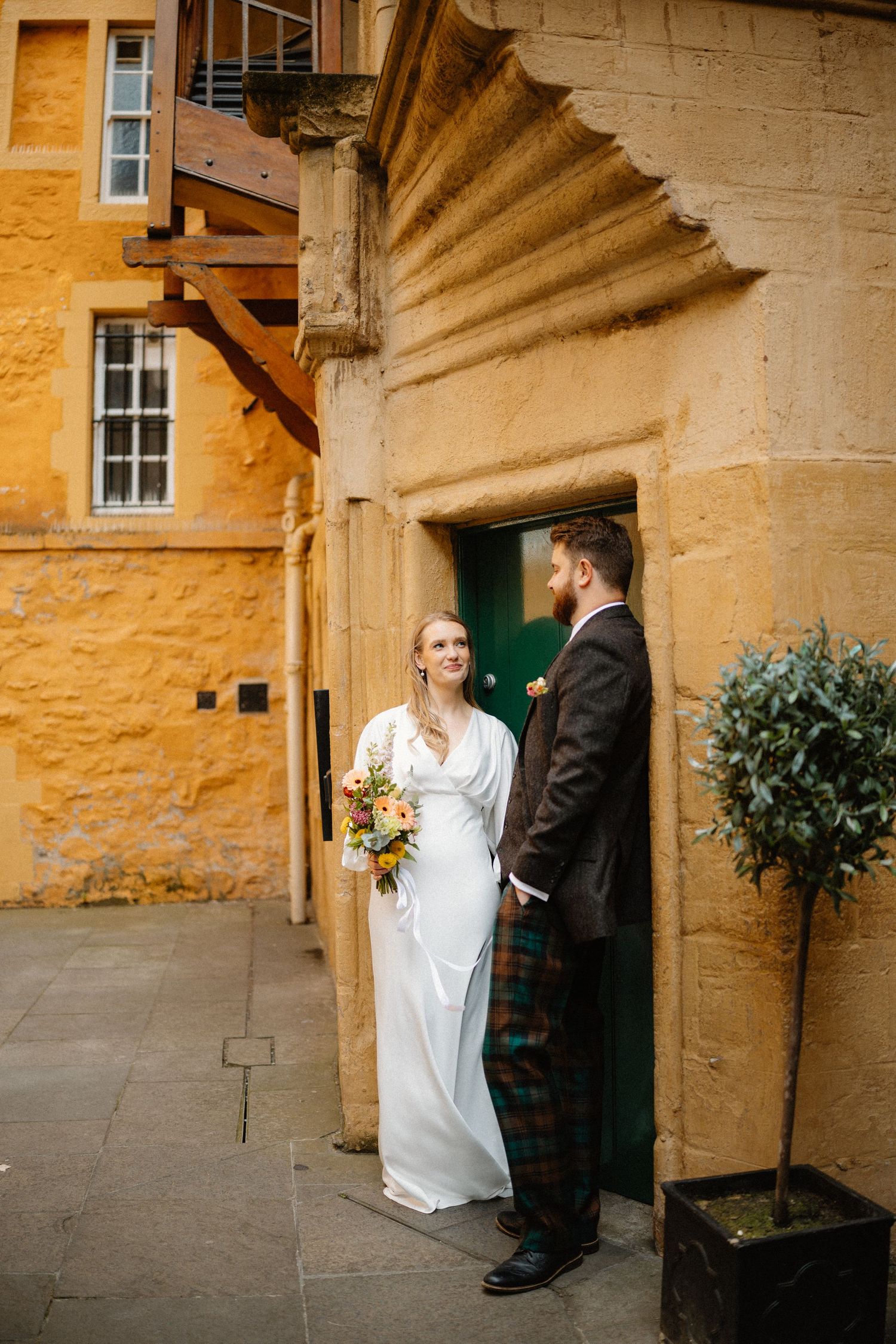 Wedding photos outside Riddles Court venue in Edinburgh