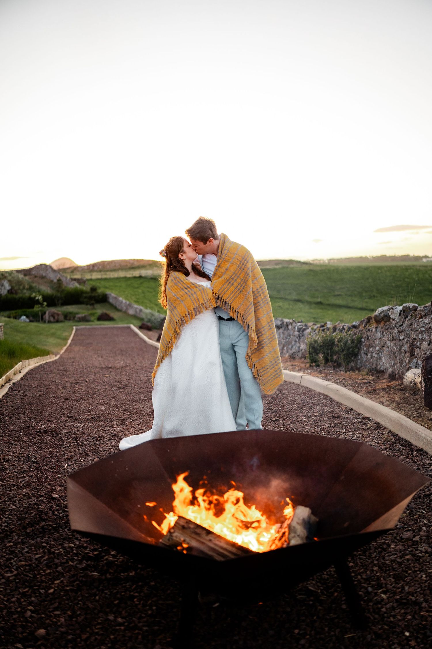 Wedding bride and groom photos by fire pit, Whitekirk Hill, Whitekirk, North Berwick