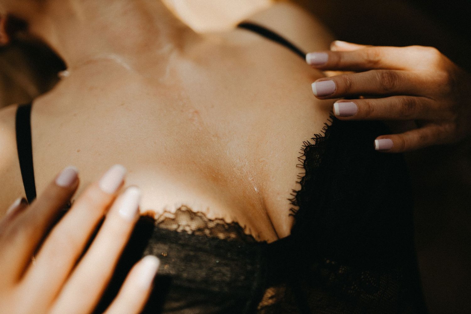 Intimate portrait with lace details in warm tones.