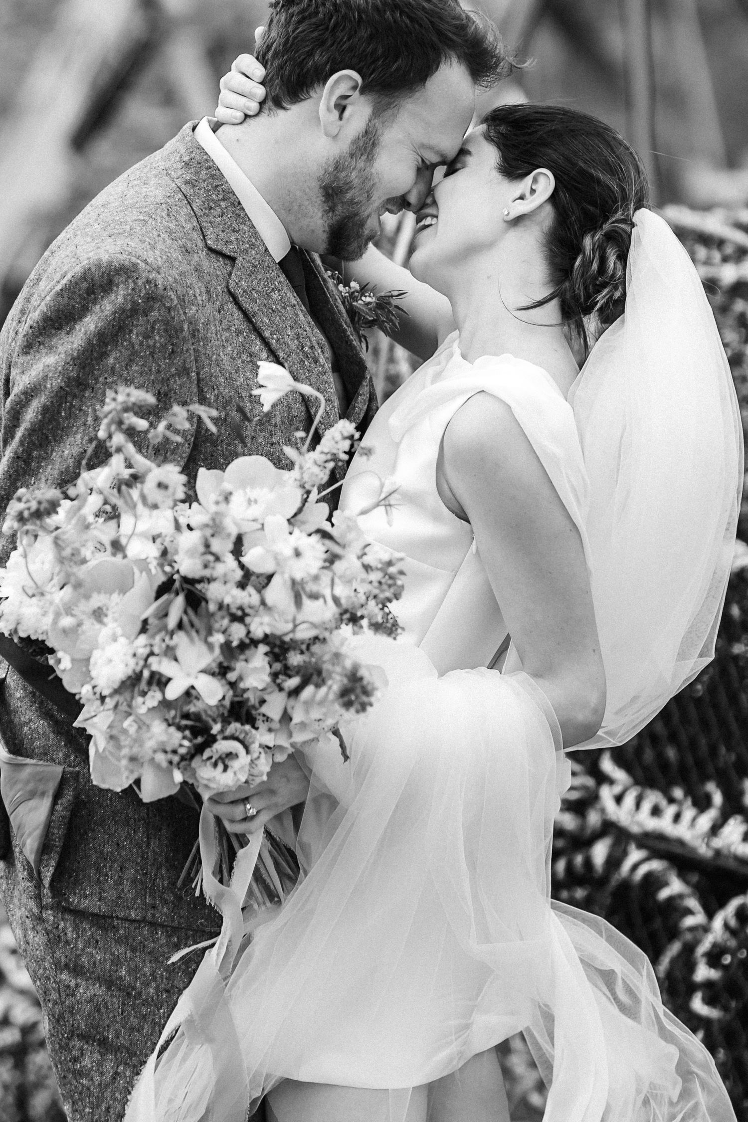 Romantic wedding portraits featuring delicate floral bouquets and intimate moments.