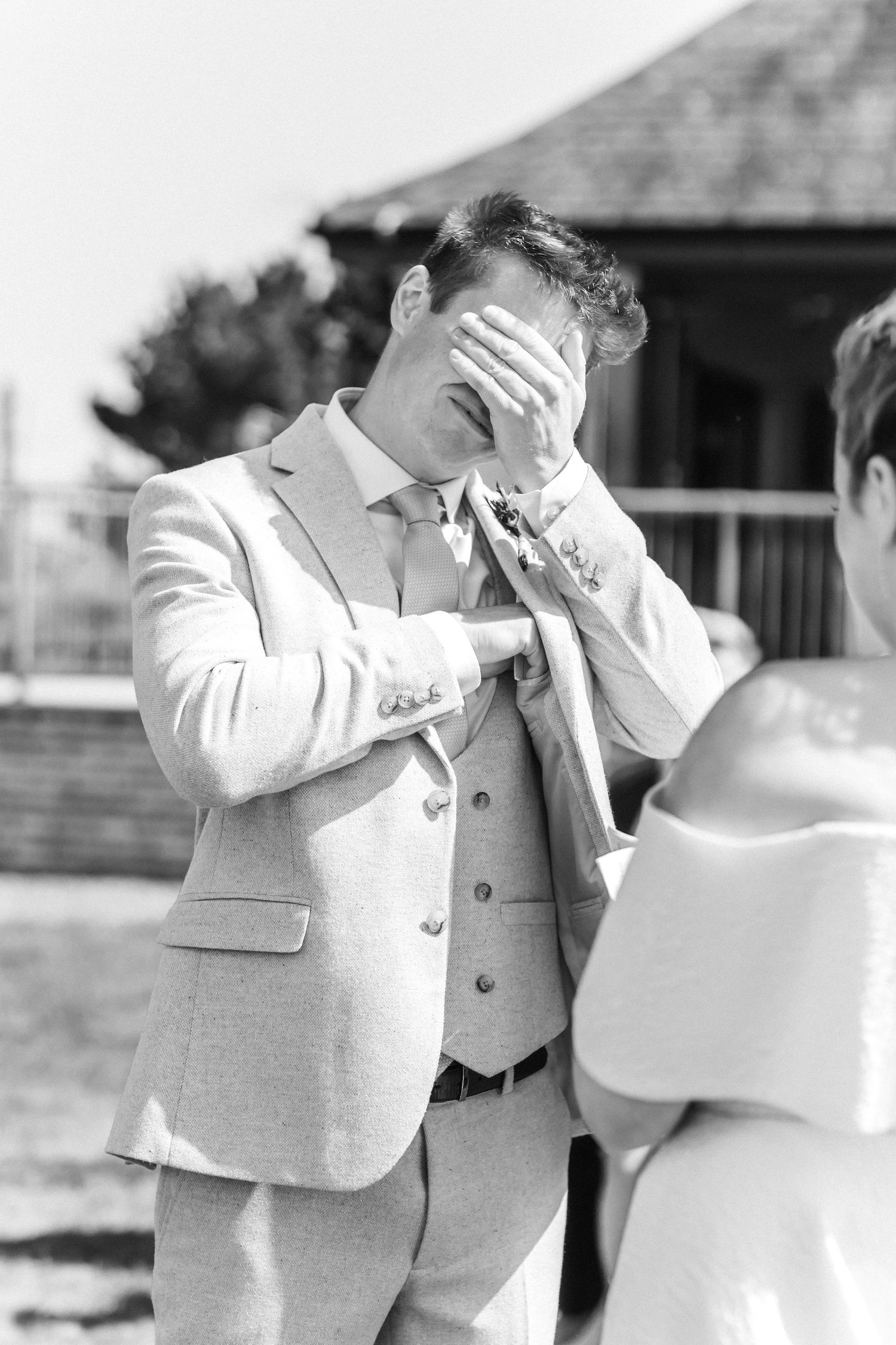 Black and white photos capture emotional reactions during wedding ceremony moments.