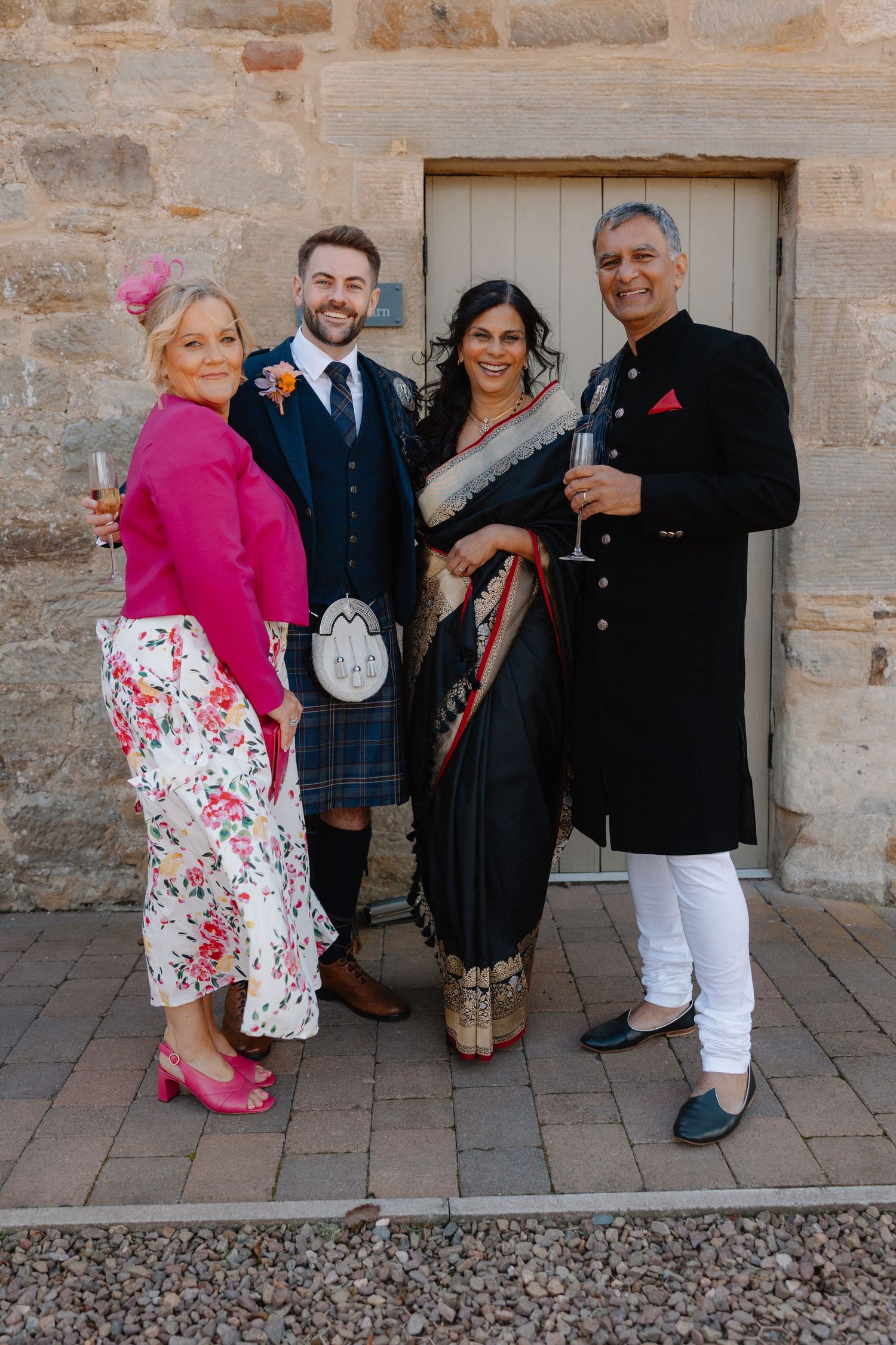 Wedding family with groom  at Rosebery Steading, Temple, Gorebridge, Scotland.