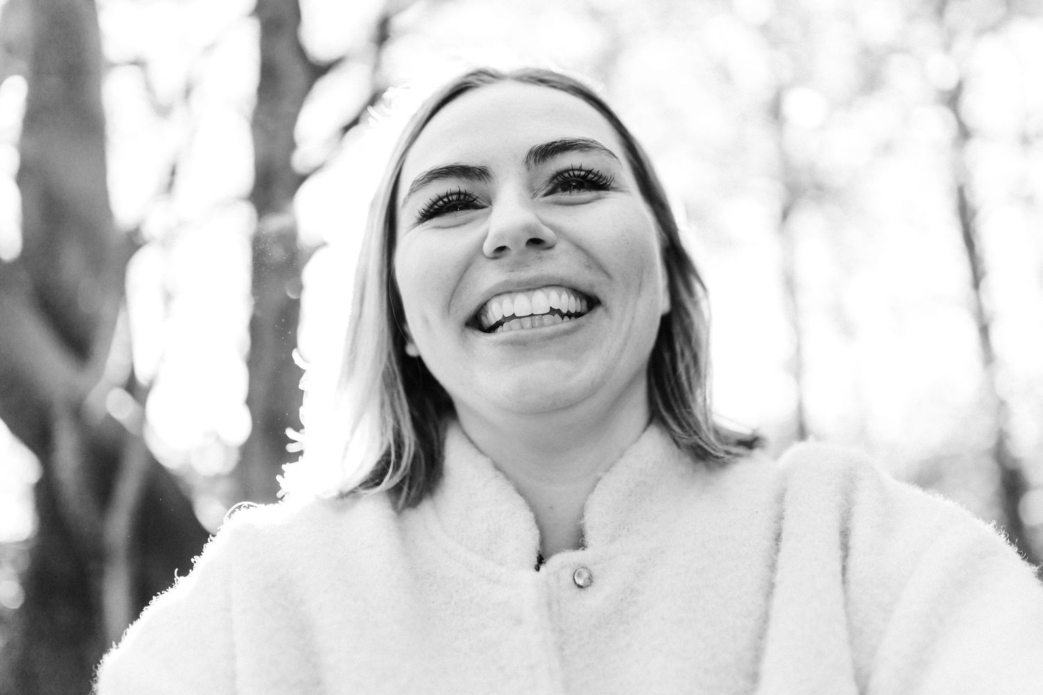 Black and white portrait series capturing joyful expressions and natural interactions.