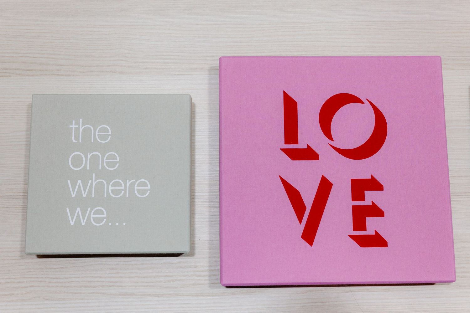 A series of pink and gray minimalist text cards arranged in a horizontal row against a white background.